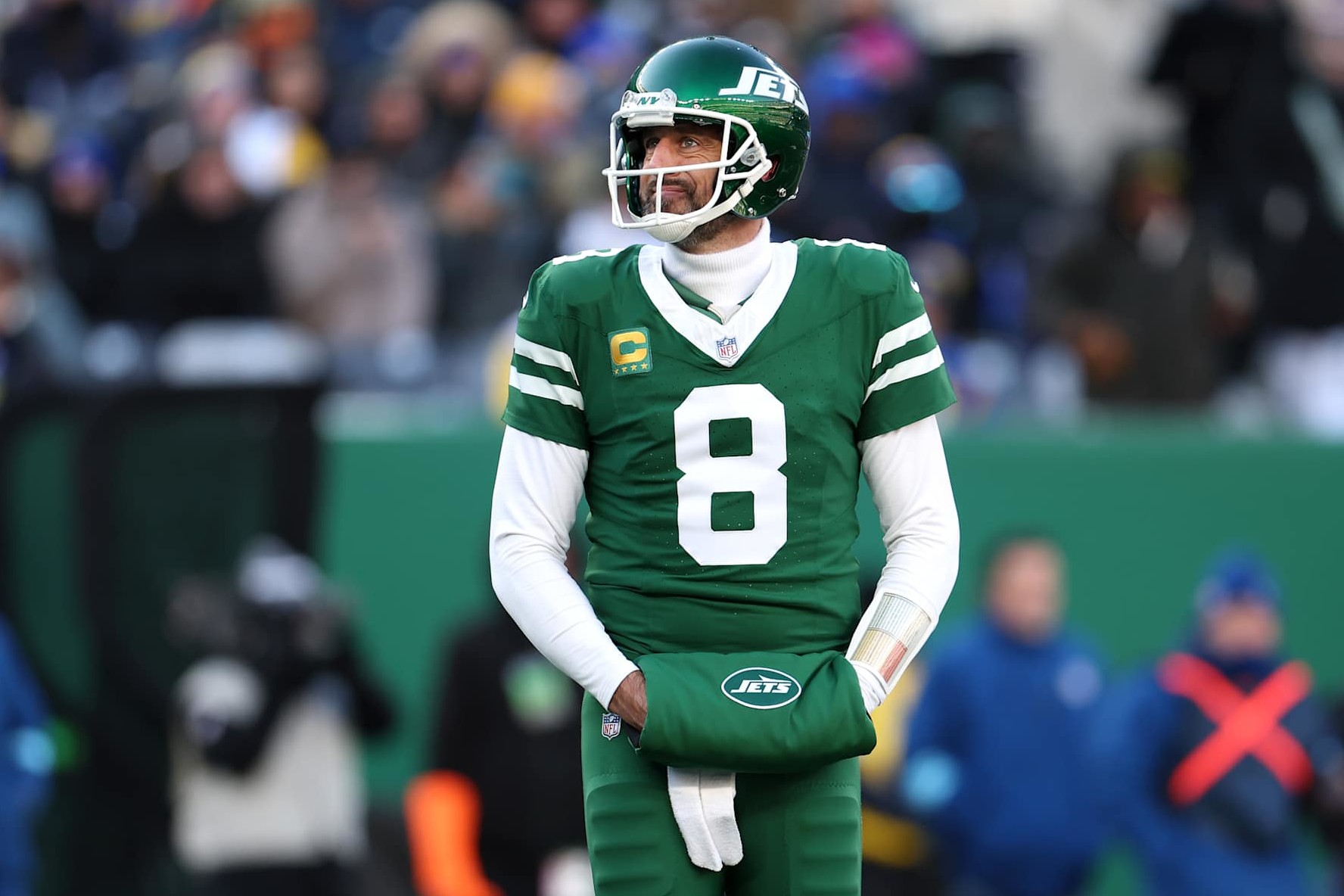 EAST RUTHERFORD, NEW JERSEY - DECEMBER 22: Aaron Rodgers #8 of the New York Jets looks on during the first half against the Los Angeles Rams at MetLife Stadium on December 22, 2024 in East Rutherford, New Jersey. (Photo by Emilee Chinn/Getty Images)