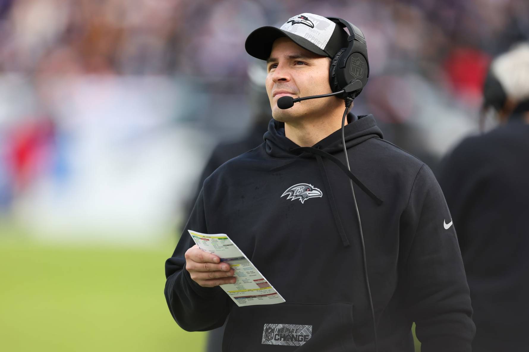 BALTIMORE, MARYLAND - DECEMBER 31: Defensive coordinator Mike Macdonald of the Baltimore Ravens looks on during the first half of the game against the Miami Dolphins at M&T Bank Stadium on December 31, 2023 in Baltimore, Maryland. (Photo by Todd Olszewski/Getty Images)