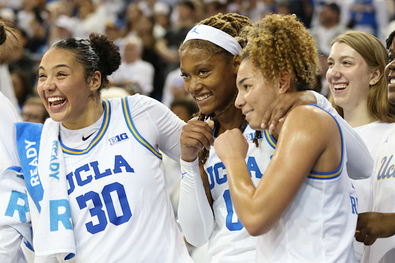 LOS ANGELES, CALIFORNIA - NOVEMBER 24: Timea Gardiner #30, Janiah Barker #0 and Kiki Rice #1 of the UCLA Bruins celebrate a77-62 win against the South Carolina Gamecocks at UCLA Pauley Pavilion on November 24, 2024 in Los Angeles, California. (Photo by Joe Scarnici/Getty Images)