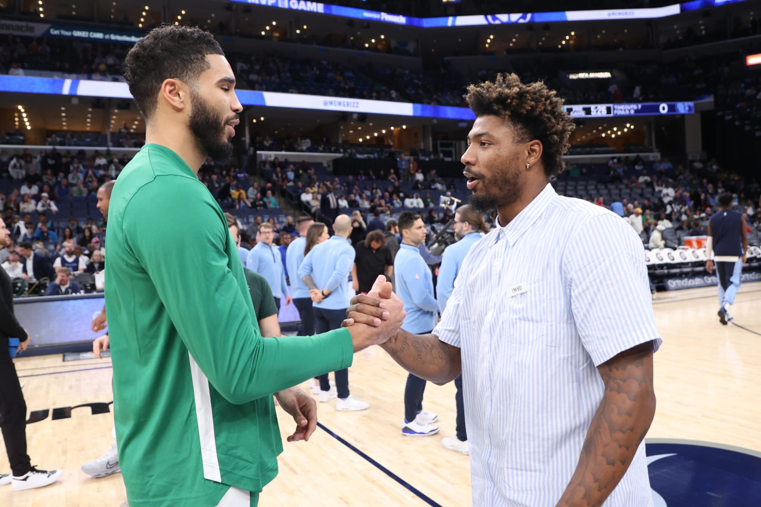 MEMPHIS, TN - NOVEMBER 19: Jayson Tatum #0 of the Boston Celtics talks to Marcus Smart #36 of the Memphis Grizzlies before the game on November 19, 2023 at FedExForum in Memphis, Tennessee. NOTE TO USER: User expressly acknowledges and agrees that, by downloading and or using this photograph, User is consenting to the terms and conditions of the Getty Images License Agreement. Mandatory Copyright Notice: Copyright 2023 NBAE (Photo by Joe Murphy/NBAE via Getty Images) MEMPHIS, TN - NOVEMBER 19: Jayson Tatum #0 of the Boston Celtics talks to Marcus Smart #36 of the Memphis Grizzlies before the game on November 19, 2023 at FedExForum in Memphis, Tennessee. NOTE TO USER: User expressly acknowledges and agrees that, by downloading and or using this photograph, User is consenting to the terms and conditions of the Getty Images License Agreement. Mandatory Copyright Notice: Copyright 2023 NBAE (Photo by Joe Murphy/NBAE via Getty Images)