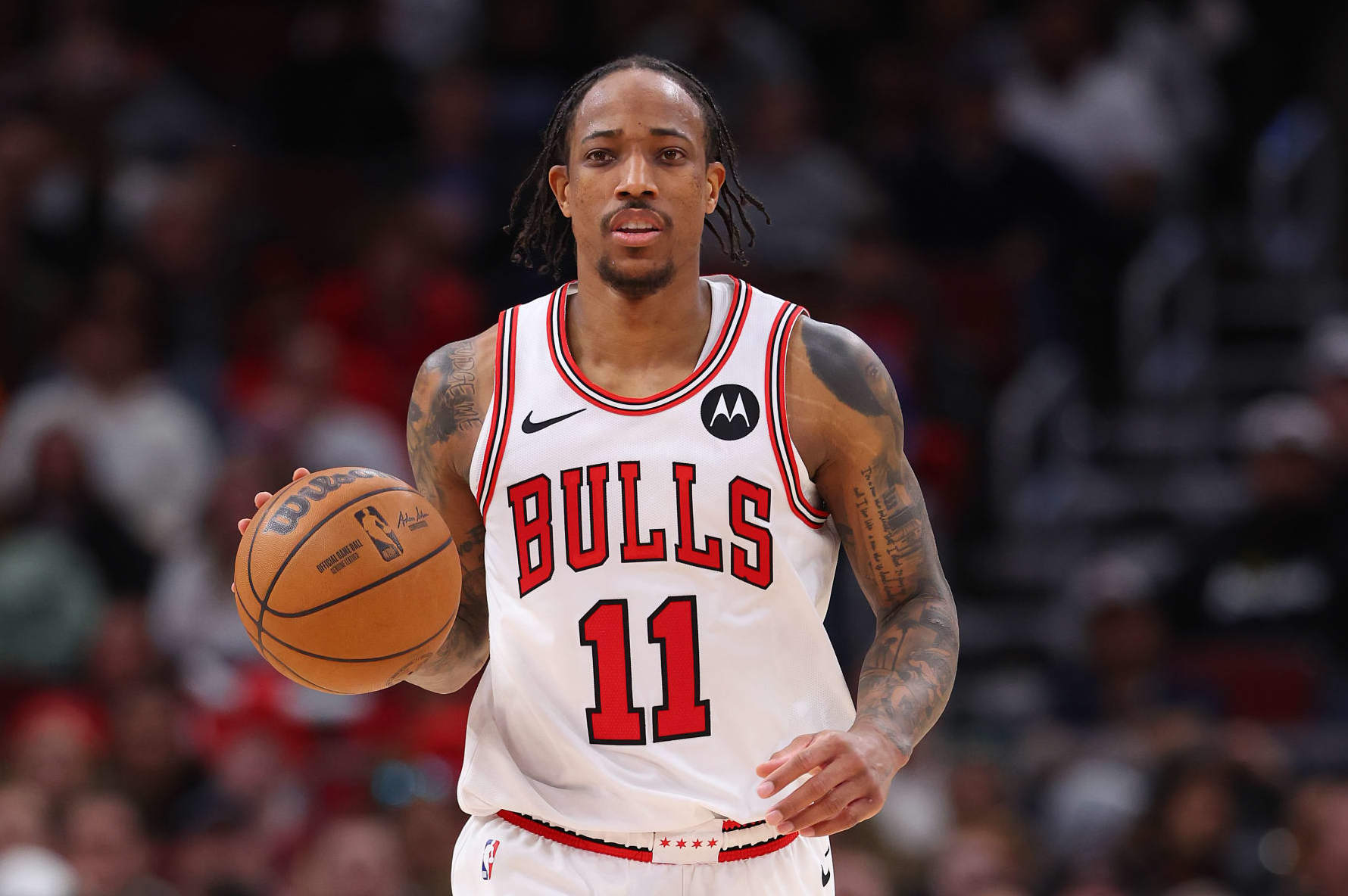 CHICAGO, ILLINOIS - APRIL 09: DeMar DeRozan #11 of the Chicago Bulls dribbles up the court against the New York Knicks during the second half at the United Center on April 09, 2024 in Chicago, Illinois. NOTE TO USER: User expressly acknowledges and agrees that, by downloading and or using this photograph, User is consenting to the terms and conditions of the Getty Images License Agreement.  (Photo by Michael Reaves/Getty Images)