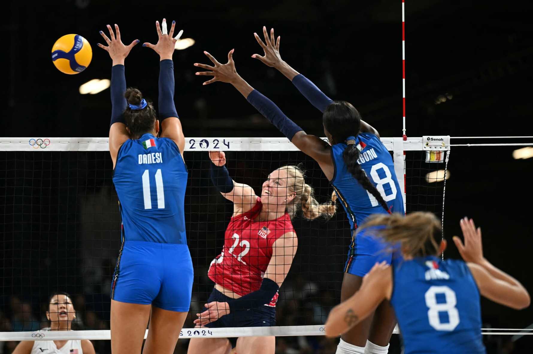 Italy's #11 Anna Danesi and Italy's #18 Paola Ogechi Egonu jump to block a ball from US' #22 Kathryn Plummer in the women's volleyball gold medal match between USA and Italy at the South Paris Arena 1 in Paris during the Paris 2024 Olympic Games on August 11, 2024. (Photo by PATRICIA DE MELO MOREIRA / AFP) (Photo by PATRICIA DE MELO MOREIRA/AFP via Getty Images)