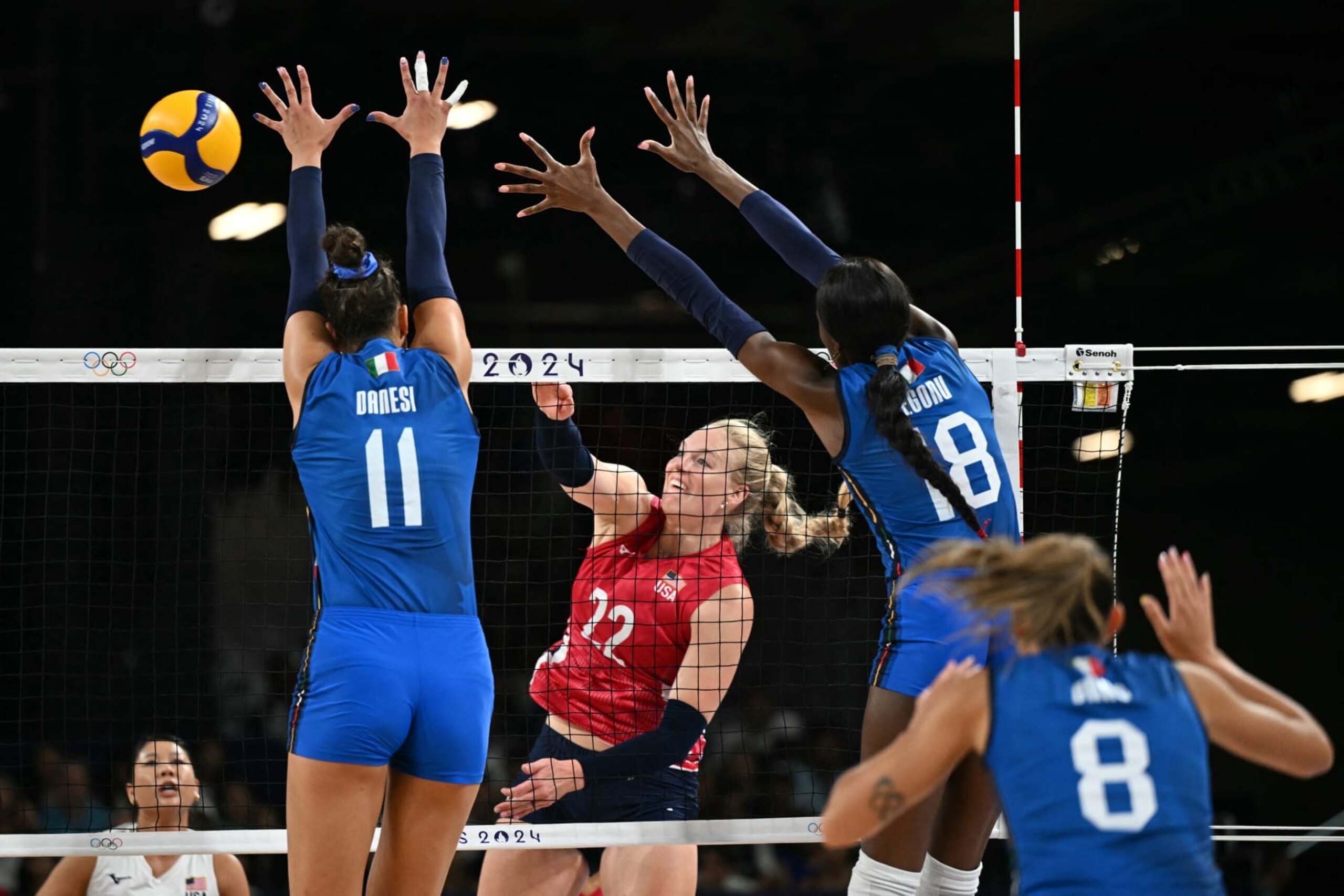 Italy's #11 Anna Danesi and Italy's #18 Paola Ogechi Egonu jump to block a ball from US' #22 Kathryn Plummer in the women's volleyball gold medal match between USA and Italy at the South Paris Arena 1 in Paris during the Paris 2024 Olympic Games on August 11, 2024. (Photo by PATRICIA DE MELO MOREIRA / AFP) (Photo by PATRICIA DE MELO MOREIRA/AFP via Getty Images)