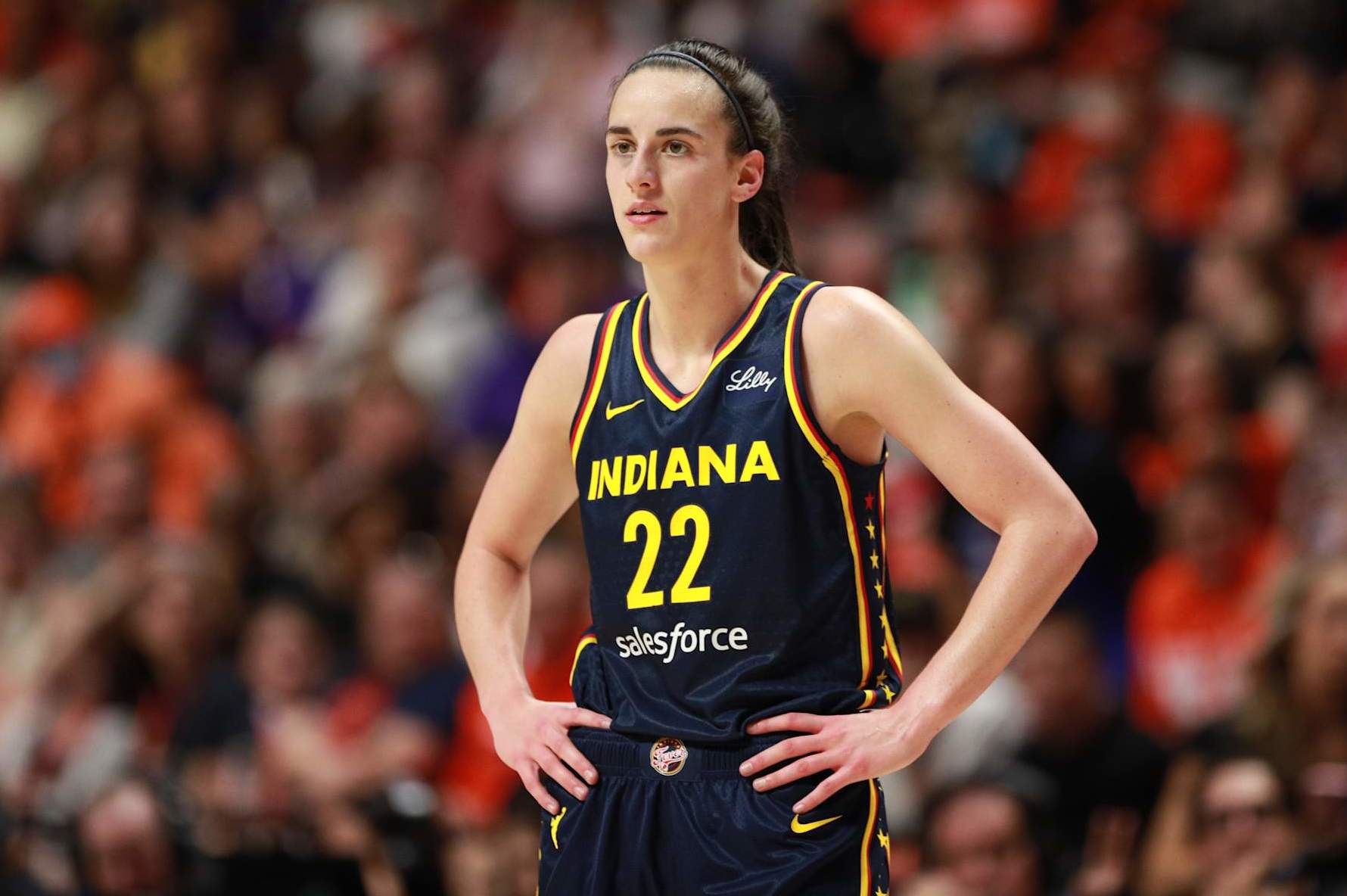 UNCASVILLE, CT - SEPTEMBER 22: Caitlin Clark #22 of the Indiana Fever looks on during the game against the Connecticut Sun during round one game one of the 2024 WNBA Playoffs on September 22, 2024 at the Mohegan Sun Arena in Uncasville, Connecticut. NOTE TO USER: User expressly acknowledges and agrees that, by downloading and or using this photograph, User is consenting to the terms and conditions of the Getty Images License Agreement. Mandatory Copyright Notice: Copyright 2024 NBAE (Photo by Chris Marion/NBAE via Getty Images)