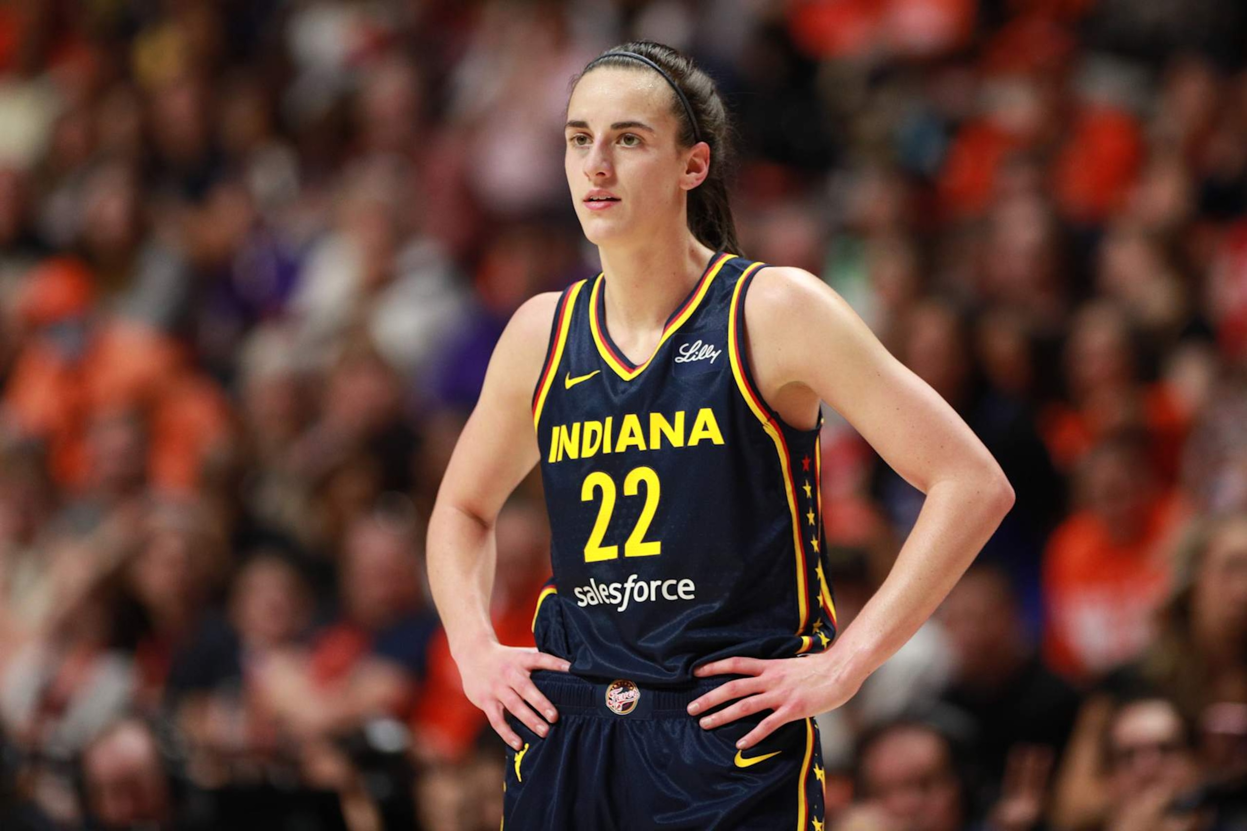 UNCASVILLE, CT - SEPTEMBER 22: Caitlin Clark #22 of the Indiana Fever looks on during the game against the Connecticut Sun during round one game one of the 2024 WNBA Playoffs on September 22, 2024 at the Mohegan Sun Arena in Uncasville, Connecticut. NOTE TO USER: User expressly acknowledges and agrees that, by downloading and or using this photograph, User is consenting to the terms and conditions of the Getty Images License Agreement. Mandatory Copyright Notice: Copyright 2024 NBAE (Photo by Chris Marion/NBAE via Getty Images)