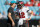 CHARLOTTE, NORTH CAROLINA - DECEMBER 26: Tom Brady #12 of the Tampa Bay Buccaneers embraces former Carolina Panthers tight end Greg Olsen during the pregame before the game against the Carolina Panthers at Bank of America Stadium on December 26, 2021 in Charlotte, North Carolina. (Photo by Grant Halverson/Getty Images)