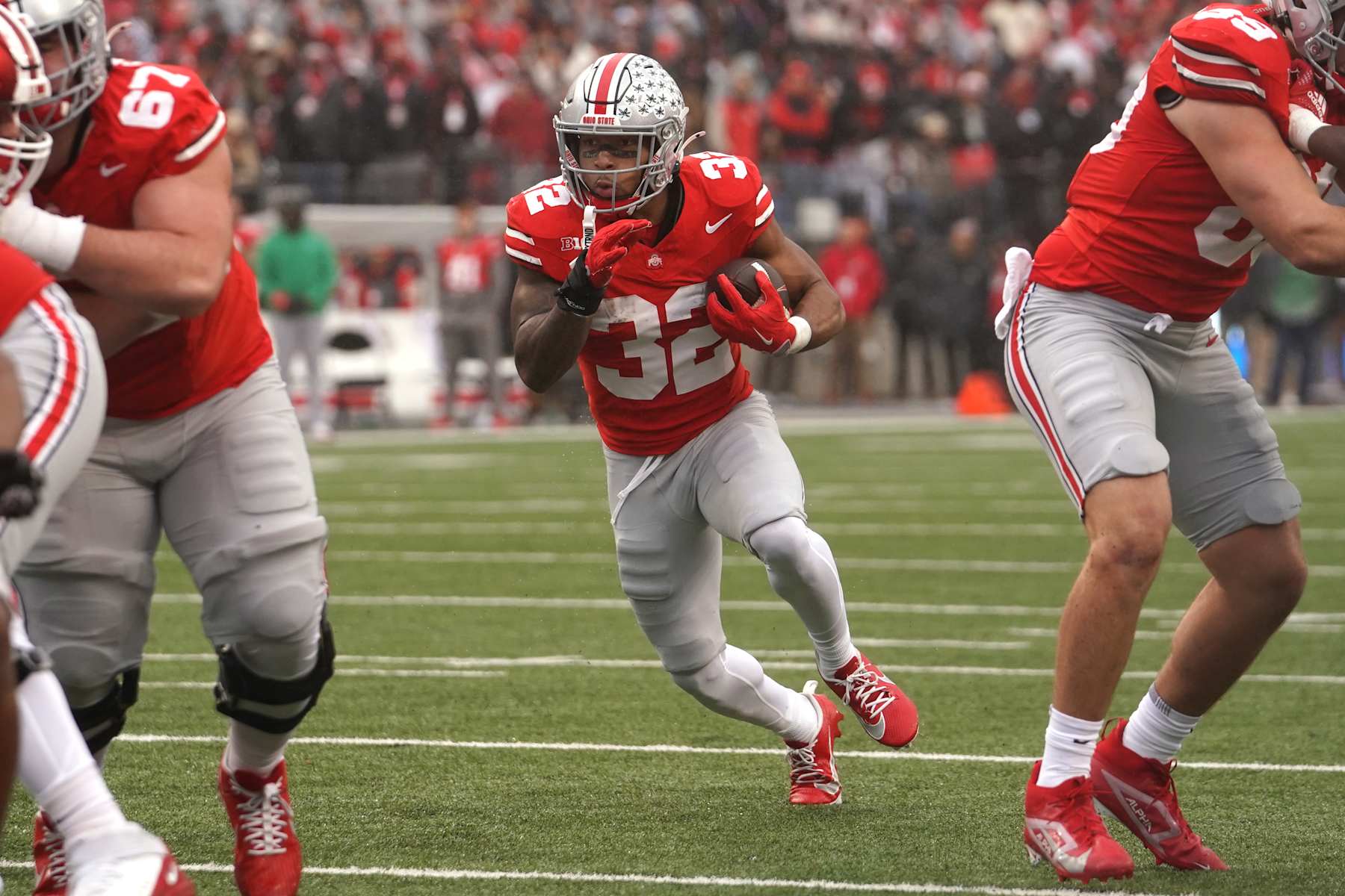 COLUMBUS, OHIO - NOVEMBER 23: Running back TreVeyon Henderson #32 of the Ohio State Buckeyes seen in action during the game against the Indiana Hoosiers at Ohio Stadium on November 23, 2024 in Columbus, Ohio. (Photo by Jason Mowry/Getty Images)