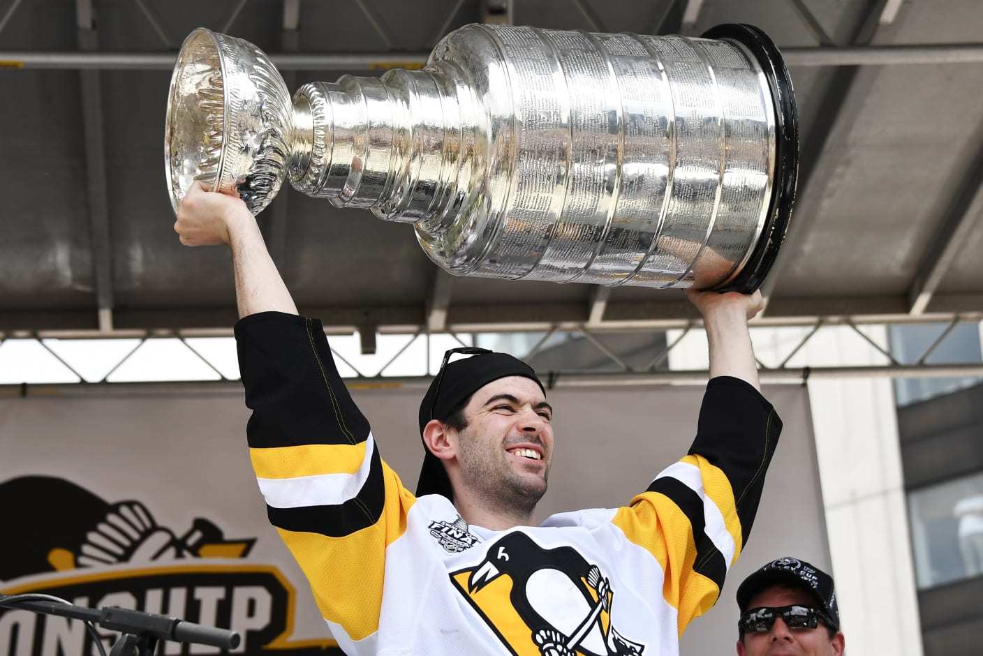 PITTSBURGH, PA - JUNE 14: Pittsburgh Penguins defenseman Justin Schultz (4) hoists the Stanley Cup in celebration during the 2017 Pittsburgh Penguins Stanley Cup Champion Victory Parade on June 14, 2017 in Pittsburgh, PA. (Photo by Jeanine Leech/Icon Sportswire via Getty Images)