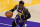Los Angeles Lakers guard Dennis Schroder dribbles during an NBA basketball game against the Charlotte Hornets Thursday, March 18, 2021, in Los Angeles. (AP Photo/Marcio Jose Sanchez)