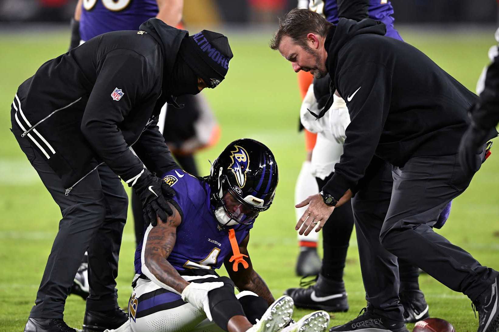 BALTIMORE, MARYLAND - JANUARY 04: Zay Flowers #4 of the Baltimore Ravens lays on the field after an apparent injury during the second quarter against the Cleveland Browns at M&T Bank Stadium on January 04, 2025 in Baltimore, Maryland. (Photo by Greg Fiume/Getty Images)