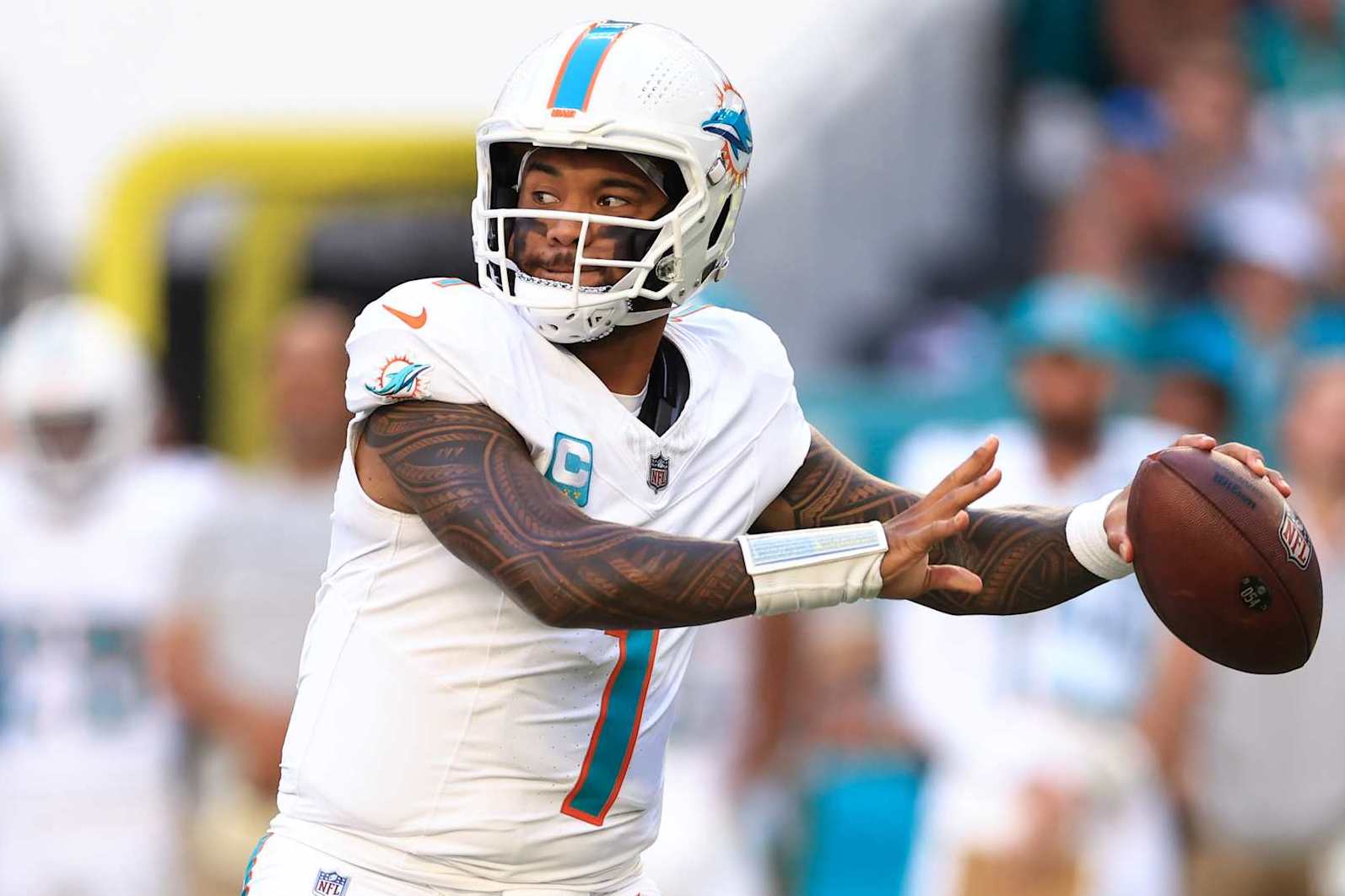 MIAMI GARDENS, FLORIDA - DECEMBER 08: Tua Tagovailoa #1 of the Miami Dolphins throws a pass against the New York Jets during the second half of the game at Hard Rock Stadium on December 08, 2024 in Miami Gardens, Florida. (Photo by Megan Briggs/Getty Images)
