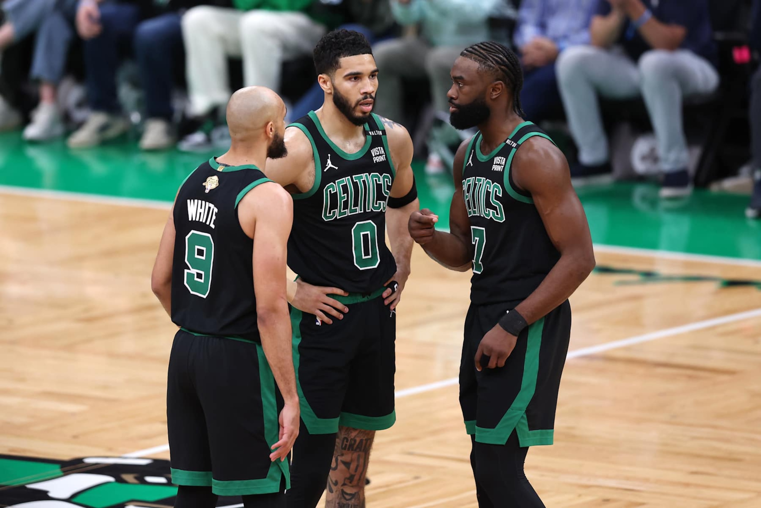 BOSTON, MASSACHUSETTS - JUNE 09: Derrick White #9, Jayson Tatum #0, and Jaylen Brown #7 of the Boston Celtics huddle during the first quarter against the Dallas Mavericks in Game Two of the 2024 NBA Finals at TD Garden on June 09, 2024 in Boston, Massachusetts. NOTE TO USER: User expressly acknowledges and agrees that, by downloading and or using this photograph, User is consenting to the terms and conditions of the Getty Images License Agreement. (Photo by Adam Glanzman/Getty Images) BOSTON, MASSACHUSETTS - JUNE 09: Derrick White #9, Jayson Tatum #0, and Jaylen Brown #7 of the Boston Celtics huddle during the first quarter against the Dallas Mavericks in Game Two of the 2024 NBA Finals at TD Garden on June 09, 2024 in Boston, Massachusetts. NOTE TO USER: User expressly acknowledges and agrees that, by downloading and or using this photograph, User is consenting to the terms and conditions of the Getty Images License Agreement. (Photo by Adam Glanzman/Getty Images)