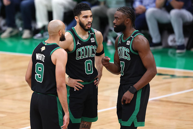 BOSTON, MASSACHUSETTS - JUNE 09: Derrick White #9, Jayson Tatum #0, and Jaylen Brown #7 of the Boston Celtics huddle during the first quarter against the Dallas Mavericks in Game Two of the 2024 NBA Finals at TD Garden on June 09, 2024 in Boston, Massachusetts. NOTE TO USER: User expressly acknowledges and agrees that, by downloading and or using this photograph, User is consenting to the terms and conditions of the Getty Images License Agreement. (Photo by Adam Glanzman/Getty Images)