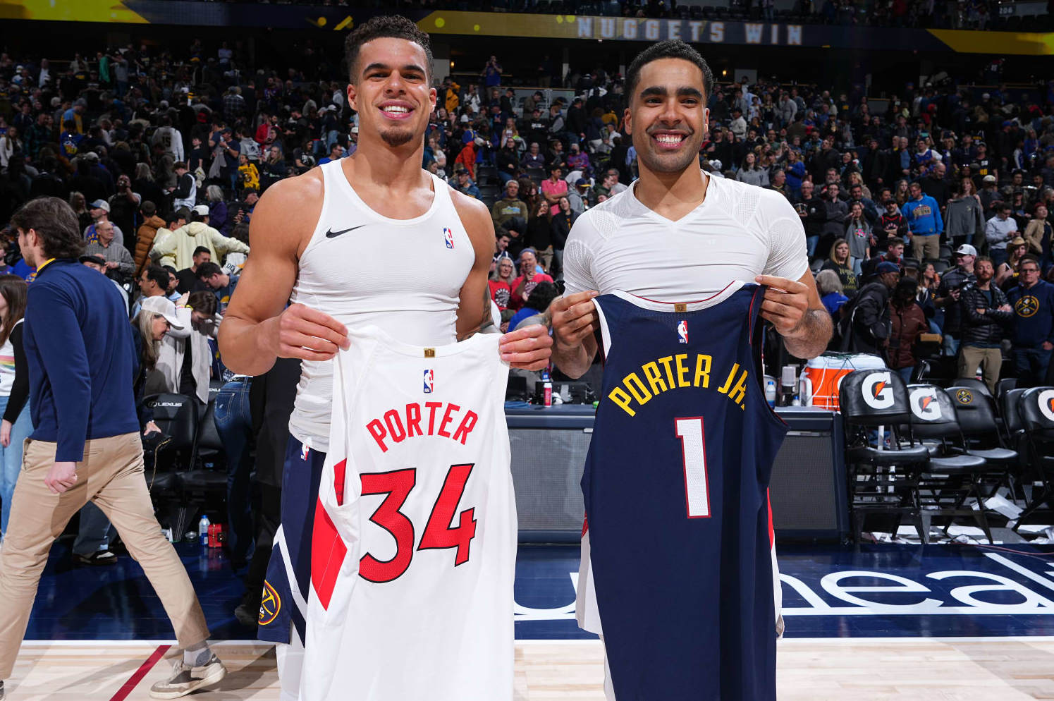 DENVER, CO - MARCH 11: Michael Porter Jr. #1 of the Denver Nuggets and Jontay Porter #34 of the Toronto Raptor swap jerseys after the game on March 11, 2024 at the Ball Arena in Denver, Colorado. NOTE TO USER: User expressly acknowledges and agrees that, by downloading and/or using this Photograph, user is consenting to the terms and conditions of the Getty Images License Agreement. Mandatory Copyright Notice: Copyright 2024 NBAE (Photo by Garrett Ellwood/NBAE via Getty Images)
