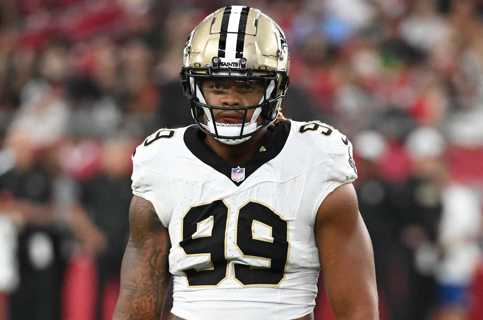 GLENDALE, ARIZONA - AUGUST 10: Chase Young #99 of the New Orleans Saints looks to the sidelines against the Arizona Cardinals at State Farm Stadium on August 10, 2024 in Glendale, Arizona. (Photo by Norm Hall/Getty Images)