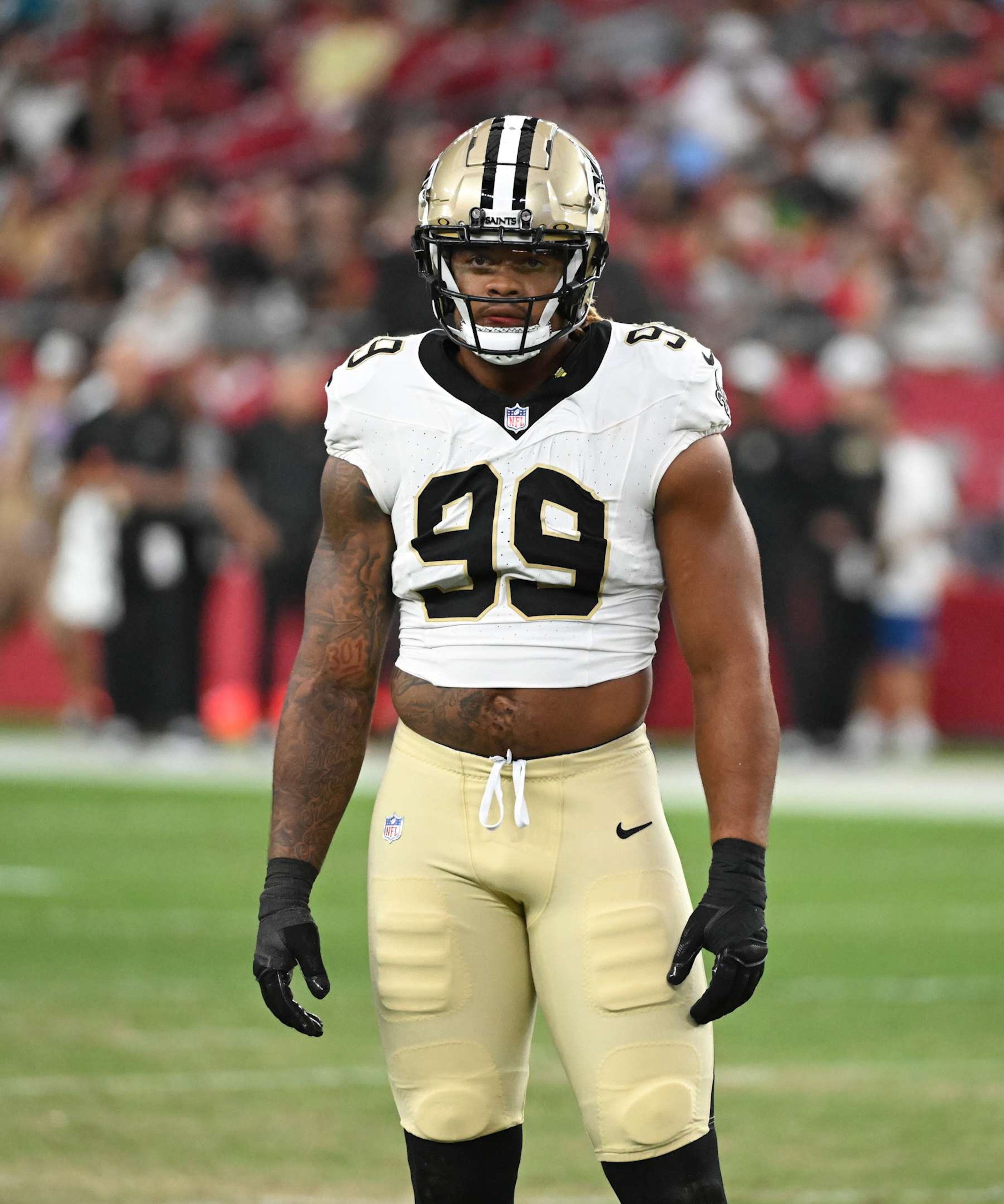 GLENDALE, ARIZONA - AUGUST 10: Chase Young #99 of the New Orleans Saints looks to the sidelines against the Arizona Cardinals at State Farm Stadium on August 10, 2024 in Glendale, Arizona.  (Photo by Norm Hall/Getty Images)