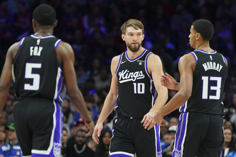 PHILADELPHIA, PENNSYLVANIA - JANUARY 12: De'Aaron Fox #5, Domantas Sabonis #10, and Keegan Murray #13 of the Sacramento Kings look on against the Philadelphia 76ers at the Wells Fargo Center on January 12, 2024 in Philadelphia, Pennsylvania. NOTE TO USER: User expressly acknowledges and agrees that, by downloading and or using this photograph, User is consenting to the terms and conditions of the Getty Images License Agreement. (Photo by Mitchell Leff/Getty Images)