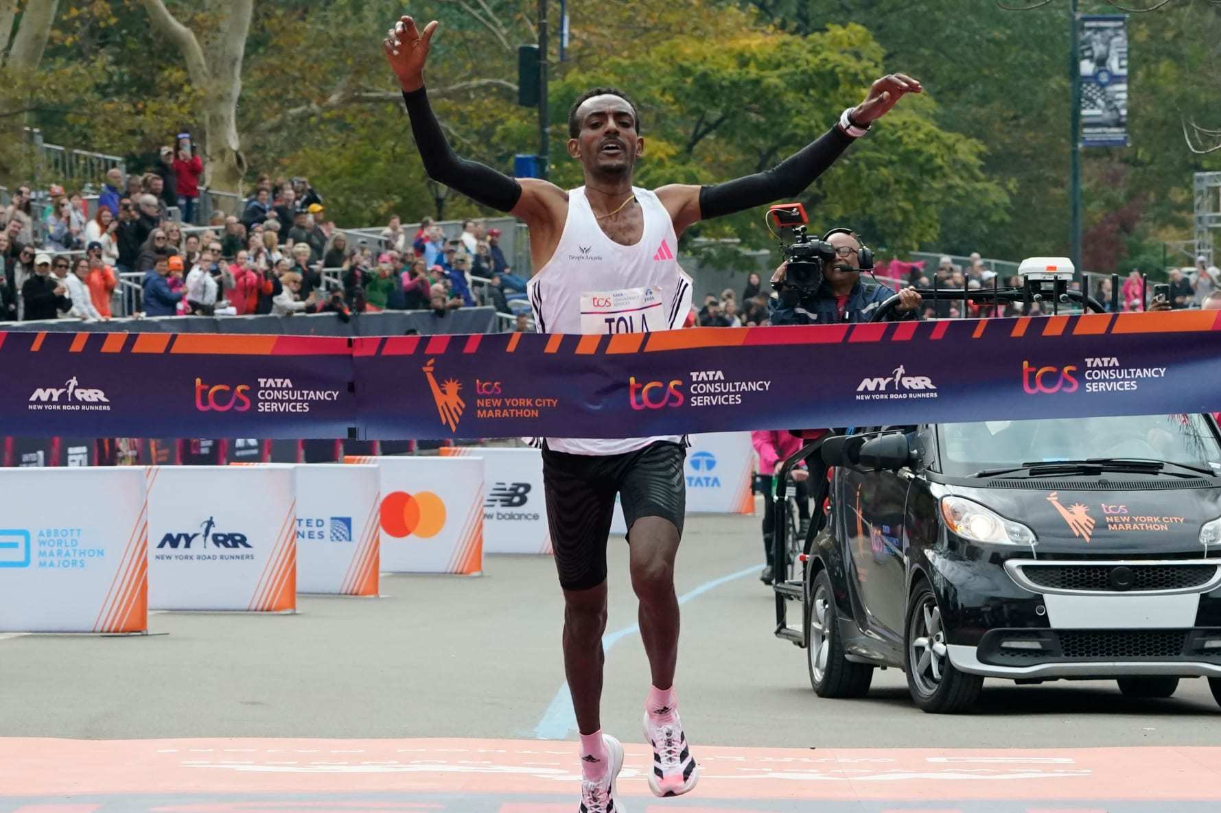 Ethiopia's Tamirat Tola celebrates winning the 52nd Edition of the New York City Marathon on November 5, 2023. (Photo by TIMOTHY A. CLARY / AFP) / ALTERNATE CROP (Photo by TIMOTHY A. CLARY/AFP via Getty Images)