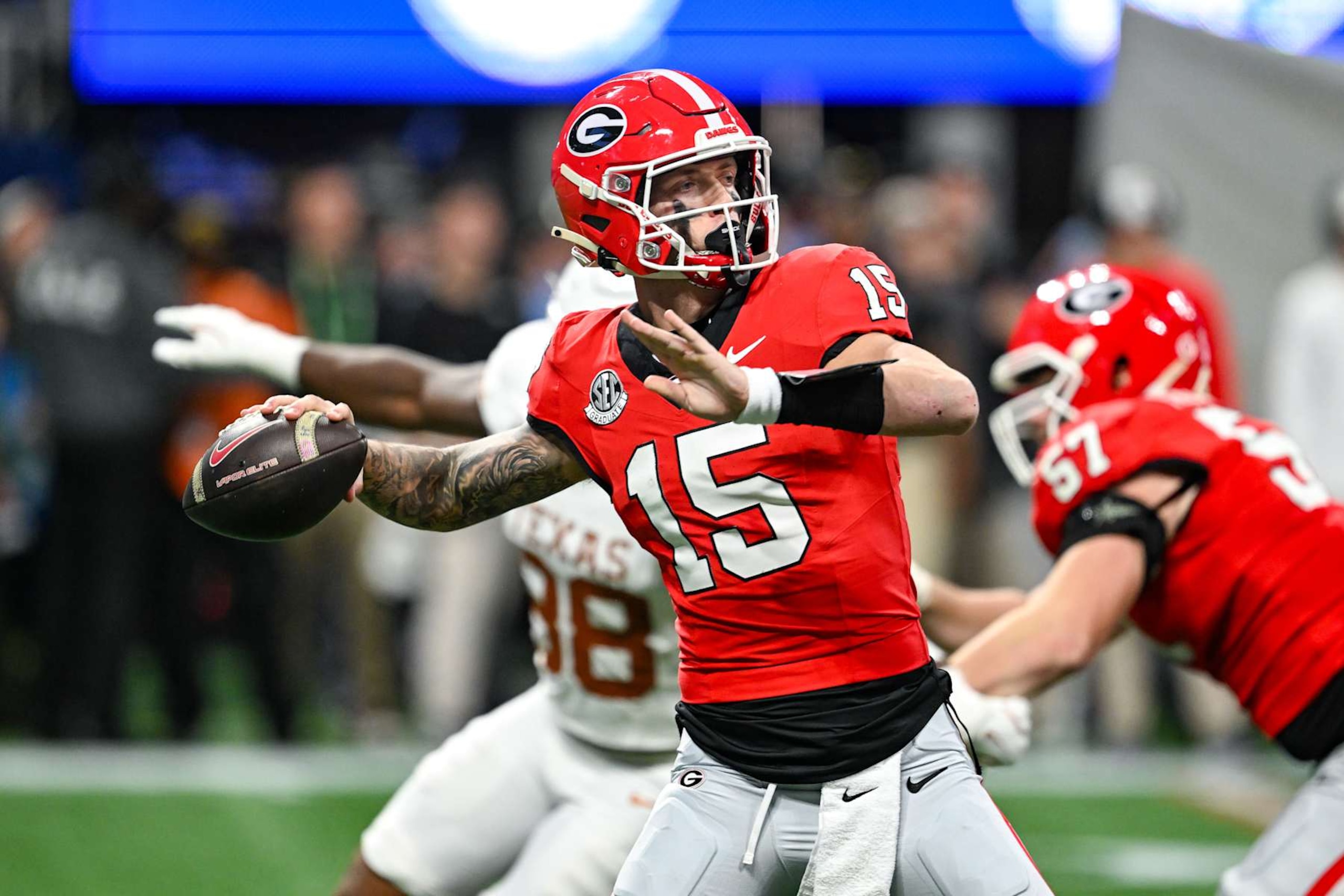 ATLANTA, GA  DECEMBER 07:  Georgia quarterback Carson Beck (15) throws a pass during the SEC Championship Game between the Texas Longhorns and the Georgia Bulldogs on December 7th, 2027 at Mercedes-Benz Stadium in Atlanta, GA.  (Photo by Rich von Biberstein/Icon Sportswire via Getty Images)