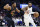 Brooklyn Nets guard Kyrie Irving (11) drives against Cleveland Cavaliers guard Donovan Mitchell (45) during the second half of an NBA basketball game, Monday, Dec. 26, 2022, in Cleveland. (AP Photo/Ron Schwane)