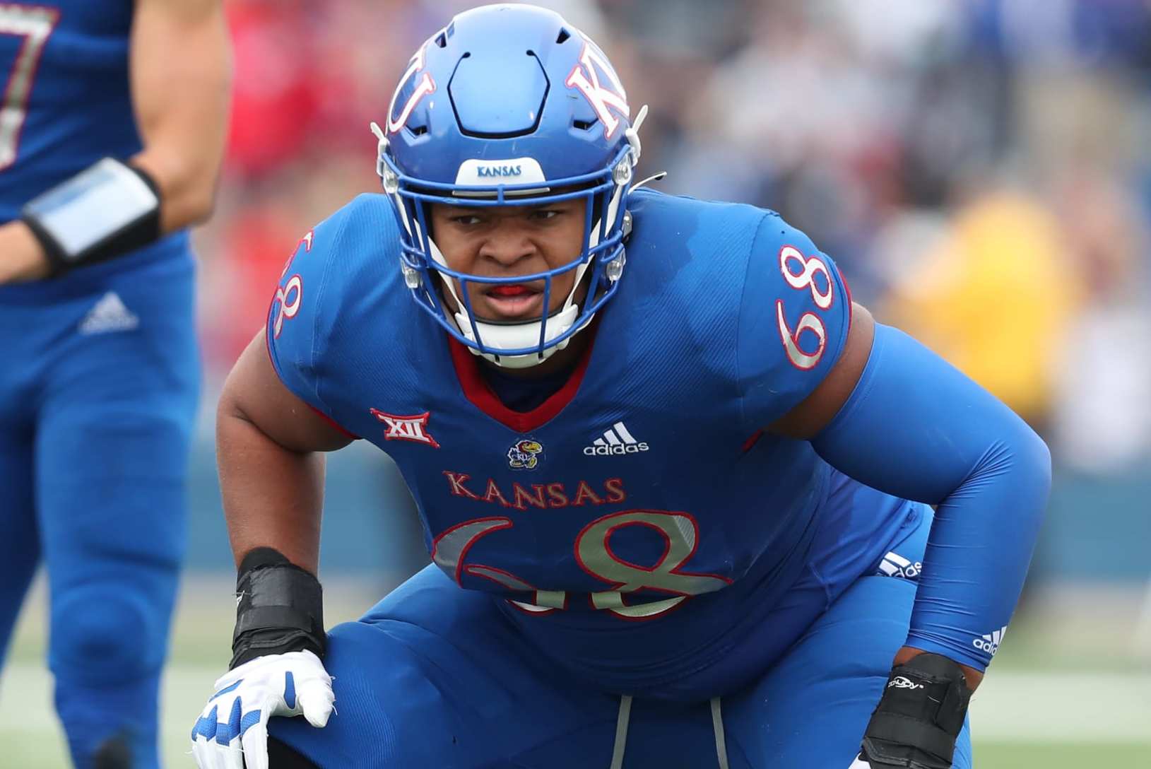 LAWRENCE, KS - OCTOBER 23: Kansas Jayhawks offensive lineman Earl Bostick Jr. (68) before the snap in the third quarter of a Big 12 football game between the Oklahoma Sooners and Kansas Jayhawks on Oct 23, 2021 at Memorial Stadium in Lawrence, KS. (Photo by Scott Winters/Icon Sportswire via Getty Images)