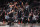 BROOKLYN, NY - APRIL 12: Kyrie Irving #11 hi-fives Kevin Durant #7 and Andre Drummond #0 of the Brooklyn Nets during the game against the Cleveland Cavaliers during the 2022 Play-In Tournament on April 12, 2022 at Barclays Center in Brooklyn, New York. NOTE TO USER: User expressly acknowledges and agrees that, by downloading and or using this Photograph, user is consenting to the terms and conditions of the Getty Images License Agreement. Mandatory Copyright Notice: Copyright 2022 NBAE (Photo by Nathaniel S. Butler/NBAE via Getty Images)