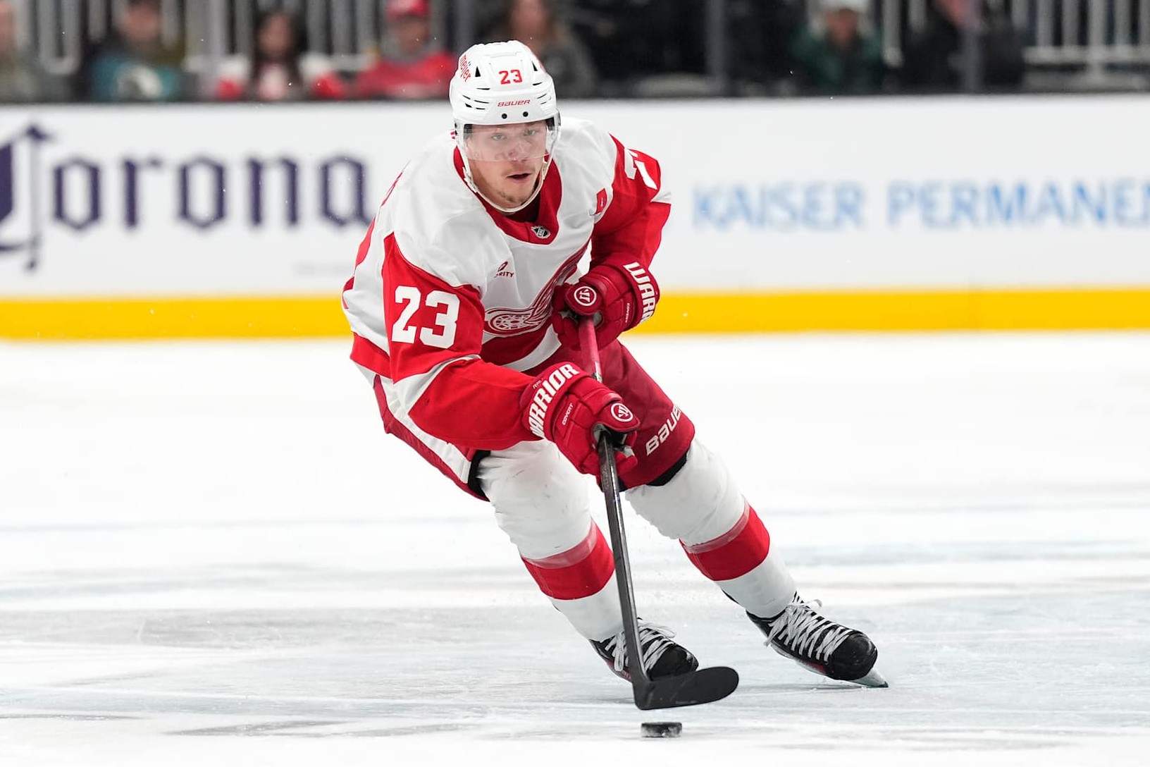 SAN JOSE, CALIFORNIA - NOVEMBER 18: Lucas Raymond #23 of the Detroit Red Wings skates with the puck against the San Jose Sharks during the first period of an NHL hockey game at SAP Center on November 18, 2024 in San Jose, California. (Photo by Thearon W. Henderson/Getty Images)