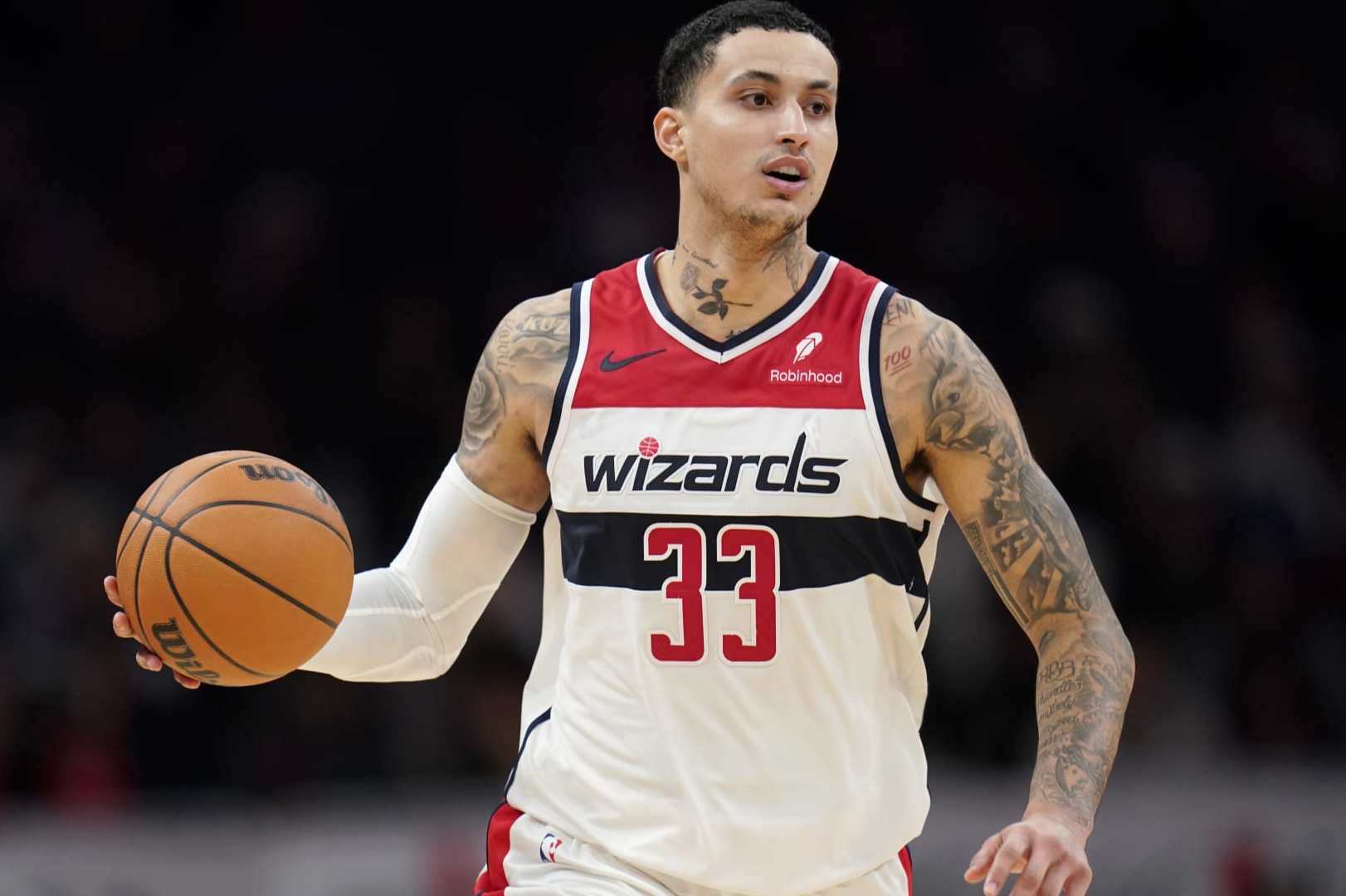 WASHINGTON, DC - JANUARY 24: Kyle Kuzma #33 of the Washington Wizards dribbles the ball during the second half against the Minnesota Timberwolves at Capital One Arena on January 24, 2024 in Washington, DC. NOTE TO USER: User expressly acknowledges and agrees that, by downloading and or using this photograph, User is consenting to the terms and conditions of the Getty Images License Agreement. (Photo by Jess Rapfogel/Getty Images)