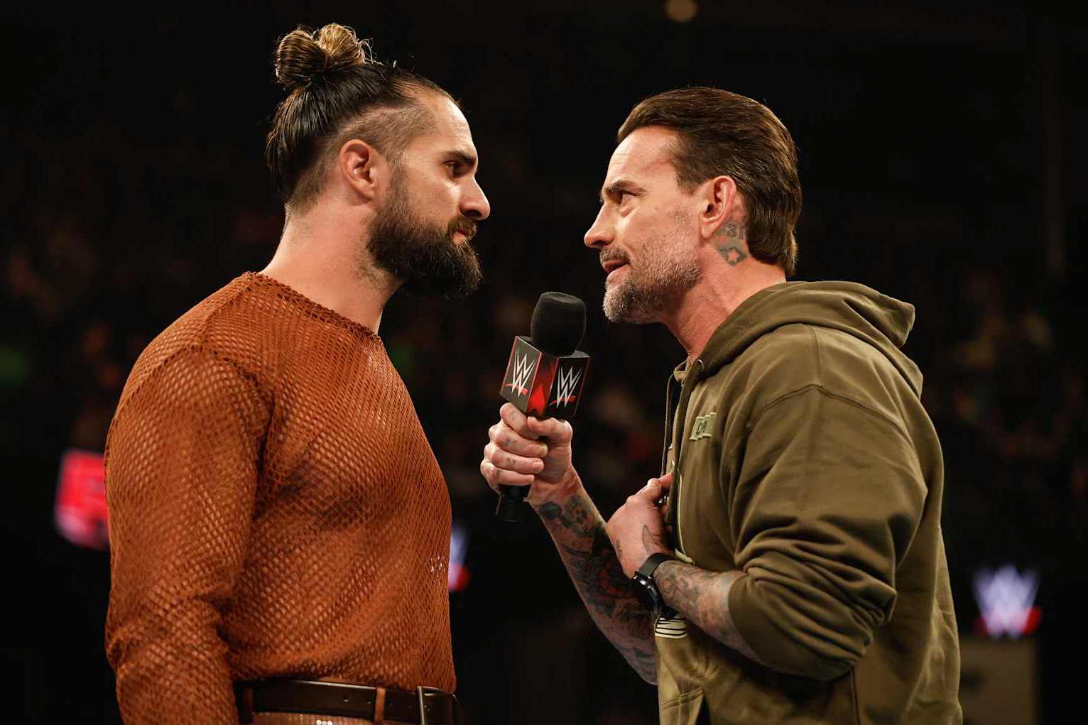 EVERETT, WASHINGTON - DECEMBER 2: Seth Rollins and CM Punk speak during Monday Night RAW at Angel of the Winds Arena on December 2, 2024 in Everett, Washington.  (Photo by WWE/Getty Images)