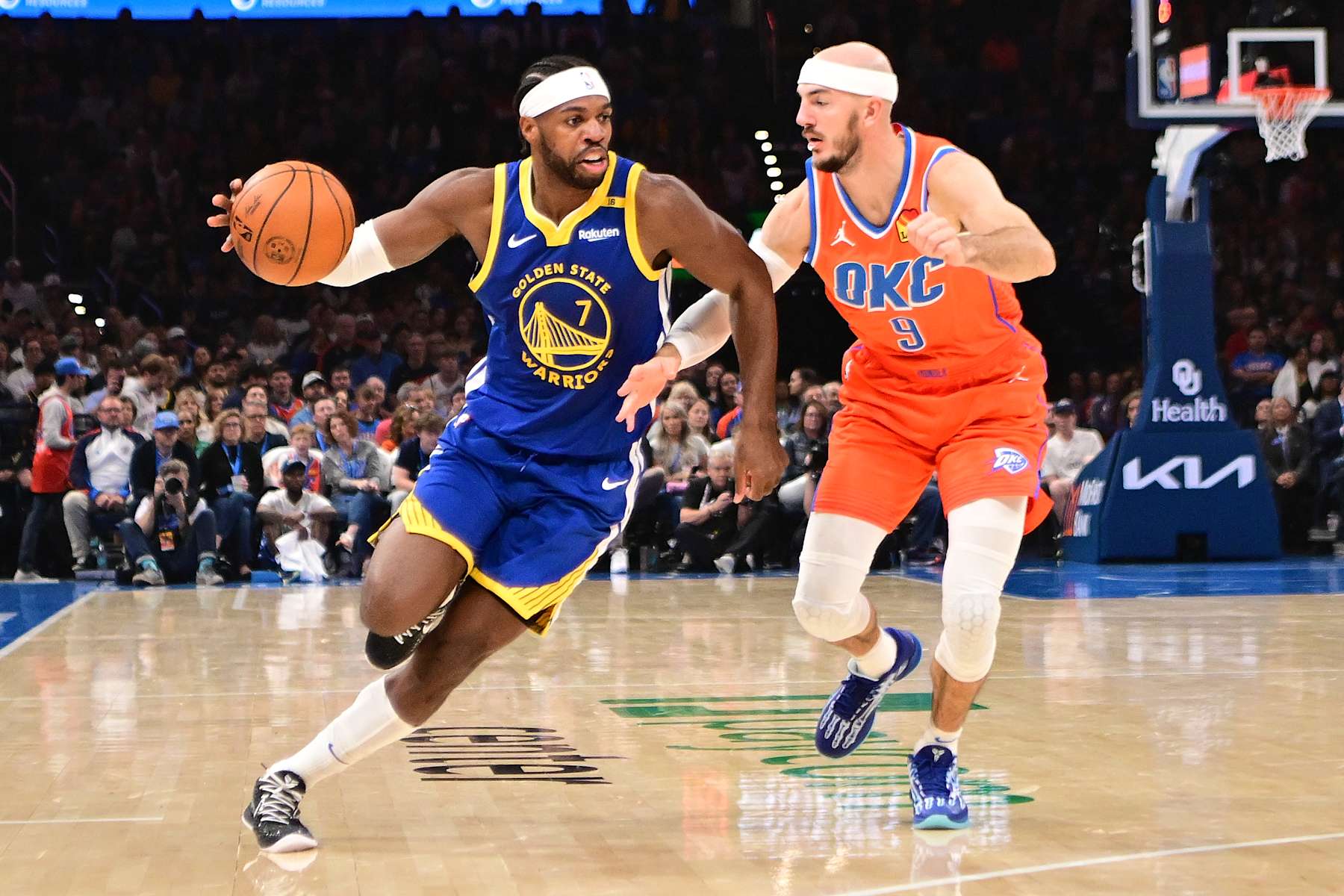 OKLAHOMA CITY, OKLAHOMA - NOVEMBER 10: Buddy Hield #7 of the Golden State Warriors attempts to drive past Alex Caruso #9 of the Oklahoma City Thunder during the first half at Paycom Center on November 10, 2024 in Oklahoma City, Oklahoma. NOTE TO USER: User expressly acknowledges and agrees that, by downloading and or using this photograph, User is consenting to the terms and conditions of the Getty Images License Agreement. (Photo by Joshua Gateley/Getty Images)