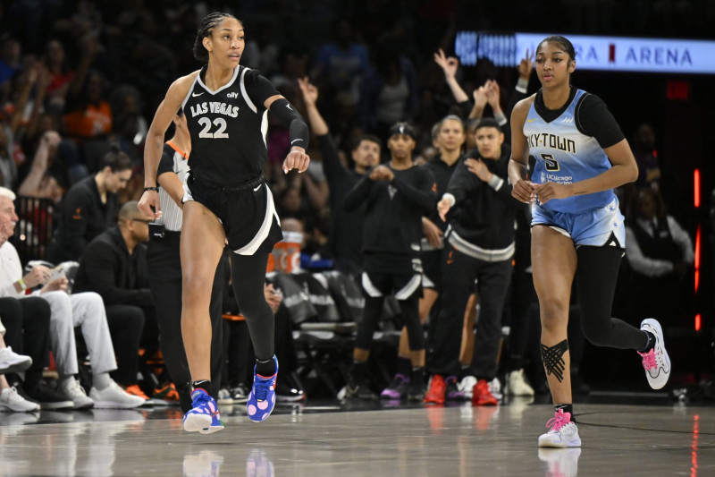 LAS VEGAS, NV - JULY 16: A'ja Wilson #22 of the Las Vegas Aces and Angel Reese #5 of the Chicago Sky look on during the game on July 16, 2024 at Michelob ULTRA Arena in Las Vegas, Nevada. NOTE TO USER: User expressly acknowledges and agrees that, by downloading and or using this photograph, User is consenting to the terms and conditions of the Getty Images License Agreement. Mandatory Copyright Notice: Copyright 2024 NBAE (Photo by David Becker/NBAE via Getty Images)