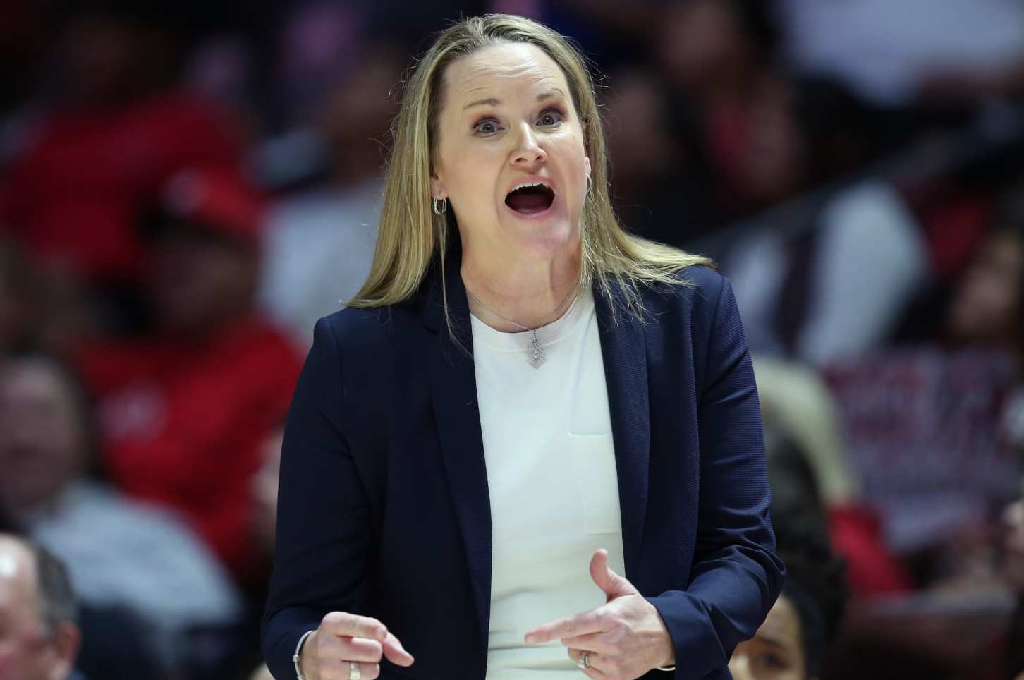 SALT LAKE CITY, UT - JANUARY 19 : Lynne Roberts head coach of the Utah Utes calls in a play against the USC Trojans during the second half of their game at the Jon M Huntsman Center on January 19, 2024 in Salt Lake City, Utah. (Photo by Chris Gardner/Getty Images)