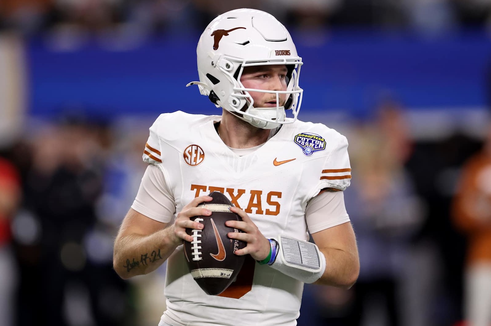 ARLINGTON, TEXAS - JANUARY 10: Quinn Ewers #3 of the Texas Longhorns drops back to pass in the first quarter against the Ohio State Buckeyes during the Goodyear Cotton Bowl at AT&T Stadium on January 10, 2025 in Arlington, Texas. (Photo by Sam Hodde/Getty Images)
