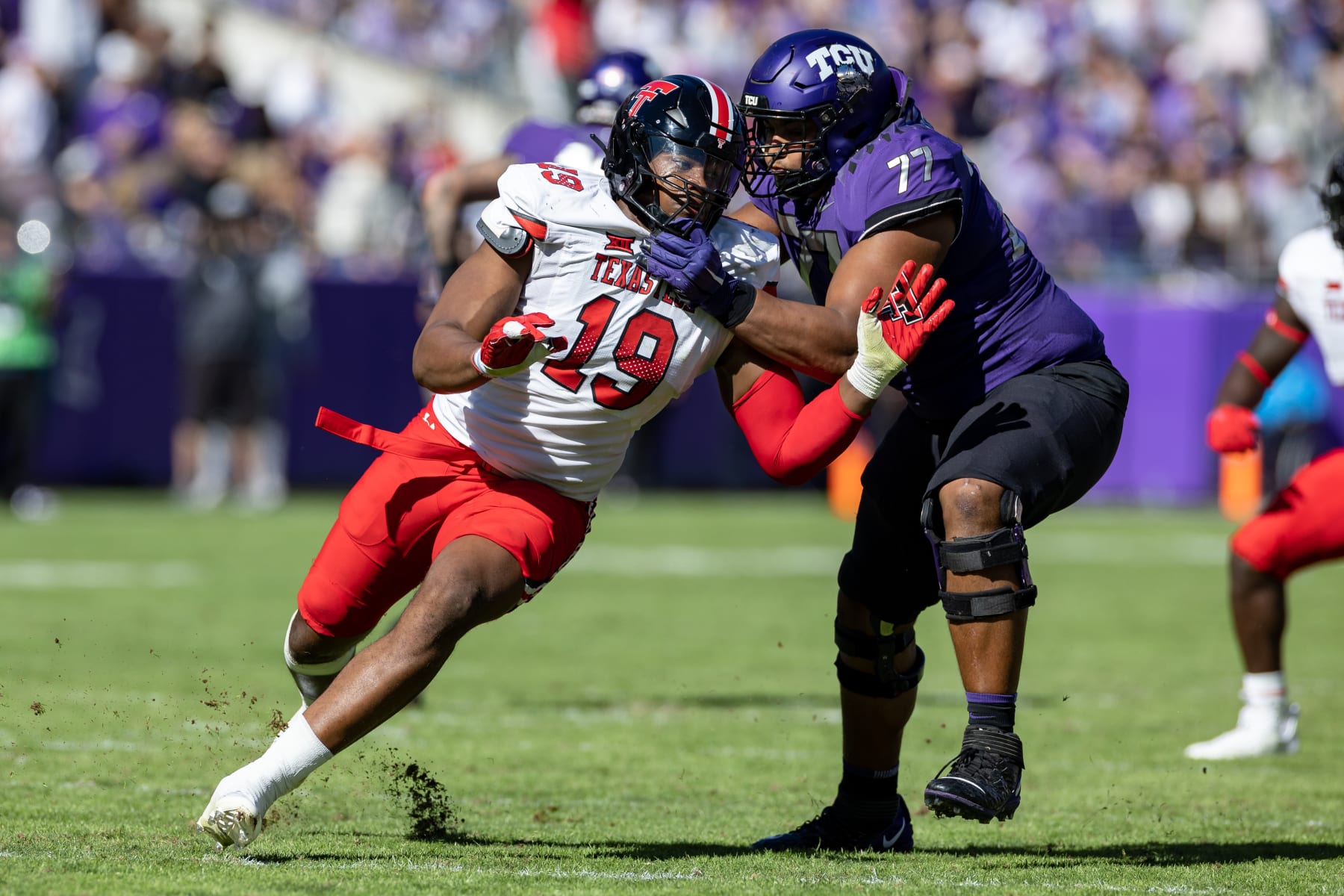 FORT WORTH, TX - NOVEMBER 05: Texas Tech Red Raiders linebacker Tyree Wilson (#19) tries to get around the block of TCU Horned Frogs offensive tackle Brandon Coleman (#77) during the college football game between the Texas Tech Red Raiders and TCU Horned Frogs on November 05, 2022 at Amon G. Carter Stadium in Fort Worth, TX. (Photo by Matthew Visinsky/Icon Sportswire via Getty Images)
