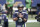 Seattle Seahawks quarterback Russell Wilson begins to warm-up before an NFL wild-card playoff football game against the Los Angeles Rams, Saturday, Jan. 9, 2021, in Seattle. (AP Photo/Ted S. Warren)