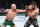 PERTH, AUSTRALIA - FEBRUARY 12: (L-R) Alexander Volkanovski of Australia punches Islam Makhachev of Russia in the UFC lightweight championship fight during the UFC 284 event at RAC Arena on February 12, 2023 in Perth, Australia. (Photo by Chris Unger/Zuffa LLC via Getty Images)