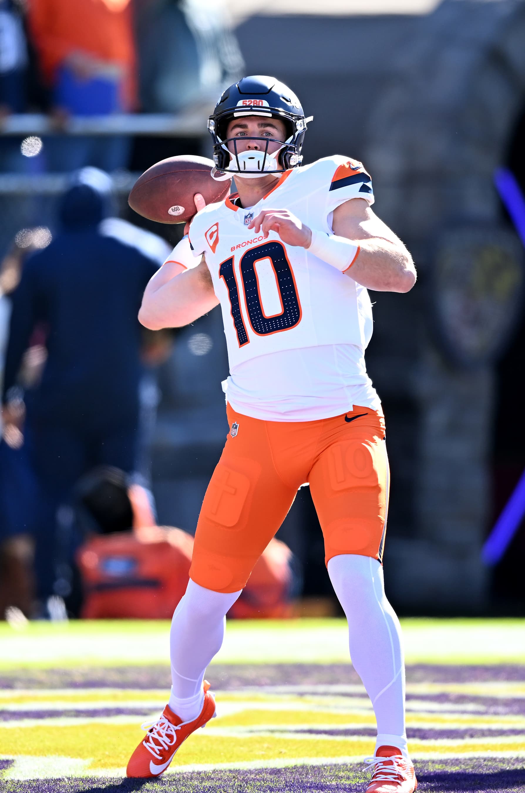 BALTIMORE, MARYLAND - NOVEMBER 03: Bo Nix #10 of the Denver Broncos warms up prior to a game against the Baltimore Ravens at M&T Bank Stadium on November 03, 2024 in Baltimore, Maryland. (Photo by G Fiume/Getty Images)