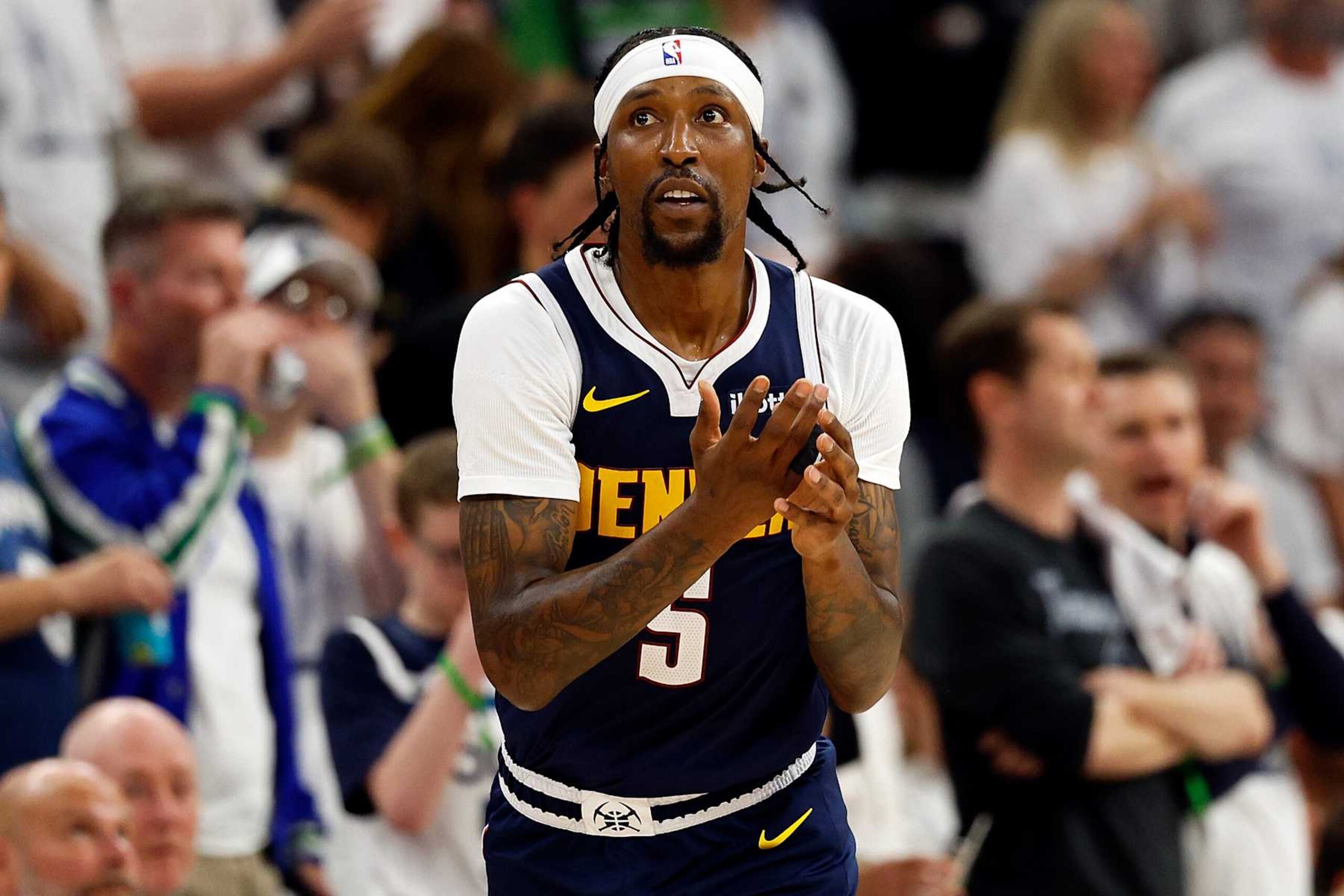 MINNEAPOLIS, MINNESOTA - MAY 12: Kentavious Caldwell-Pope #5 of the Denver Nuggets celebrates his three-point basket against the Minnesota Timberwolves in the second quarter of Game Four of the Western Conference Second Round Playoffs at Target Center on May 12, 2024 in Minneapolis, Minnesota. The Nuggets defeated the Timberwolves 115-107. (Photo by David Berding/Getty Images)