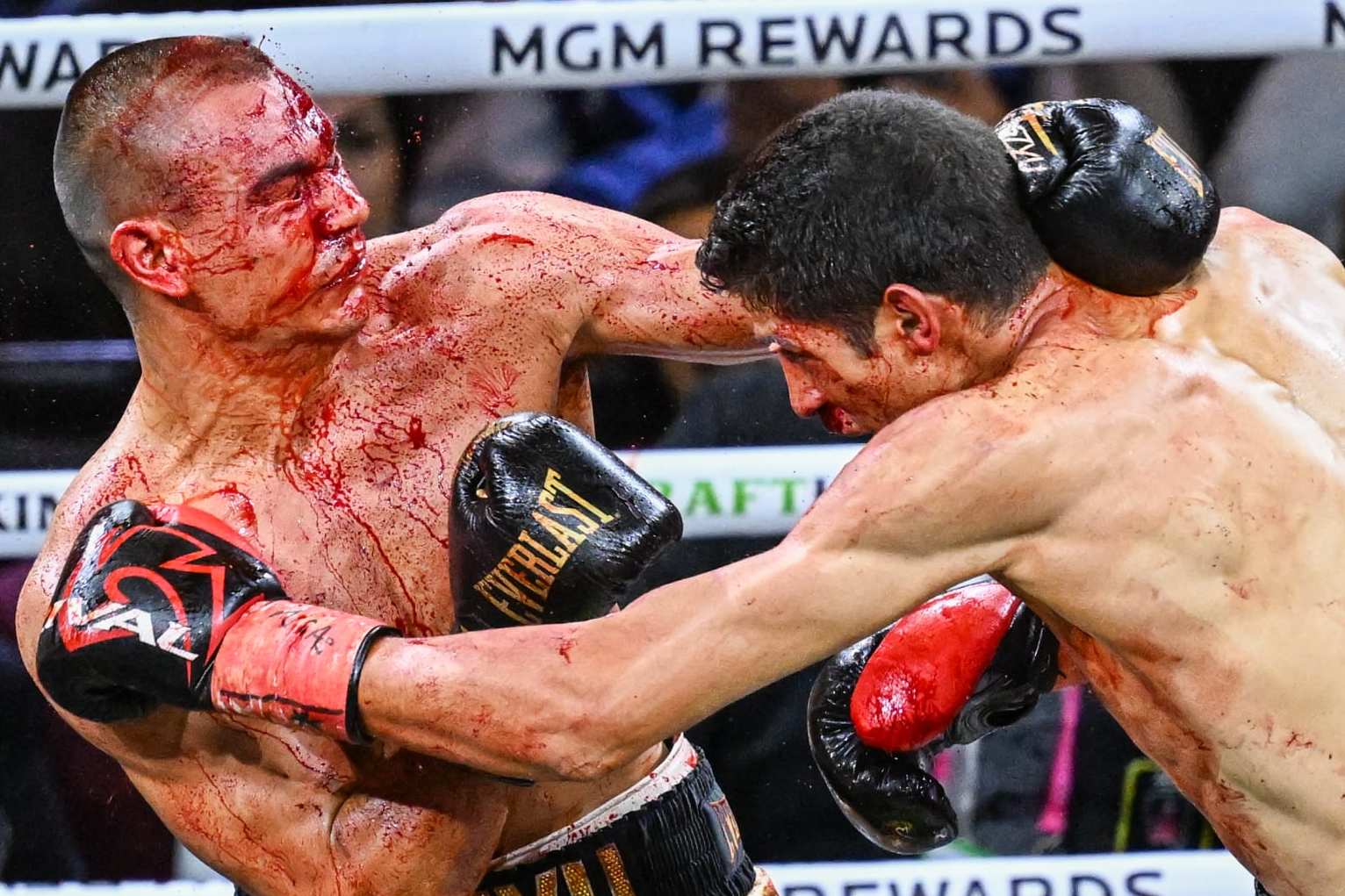 LAS VEGAS, NV - MARCH 30: (EDITORS NOTE: Image depicts graphic content) Tim Tszyu (in gold & black short) and Sebastian Fundora (in red & black short) exchange punches during their super welterweight world titles of the Premiere Boxing Championship on Saturday night as Sebastian Fundora wins at the T-Mobile Arena in Las Vegas, Nevada, United States on March 30, 2024. (Photo by Tayfun Coskun/Anadolu via Getty Images)