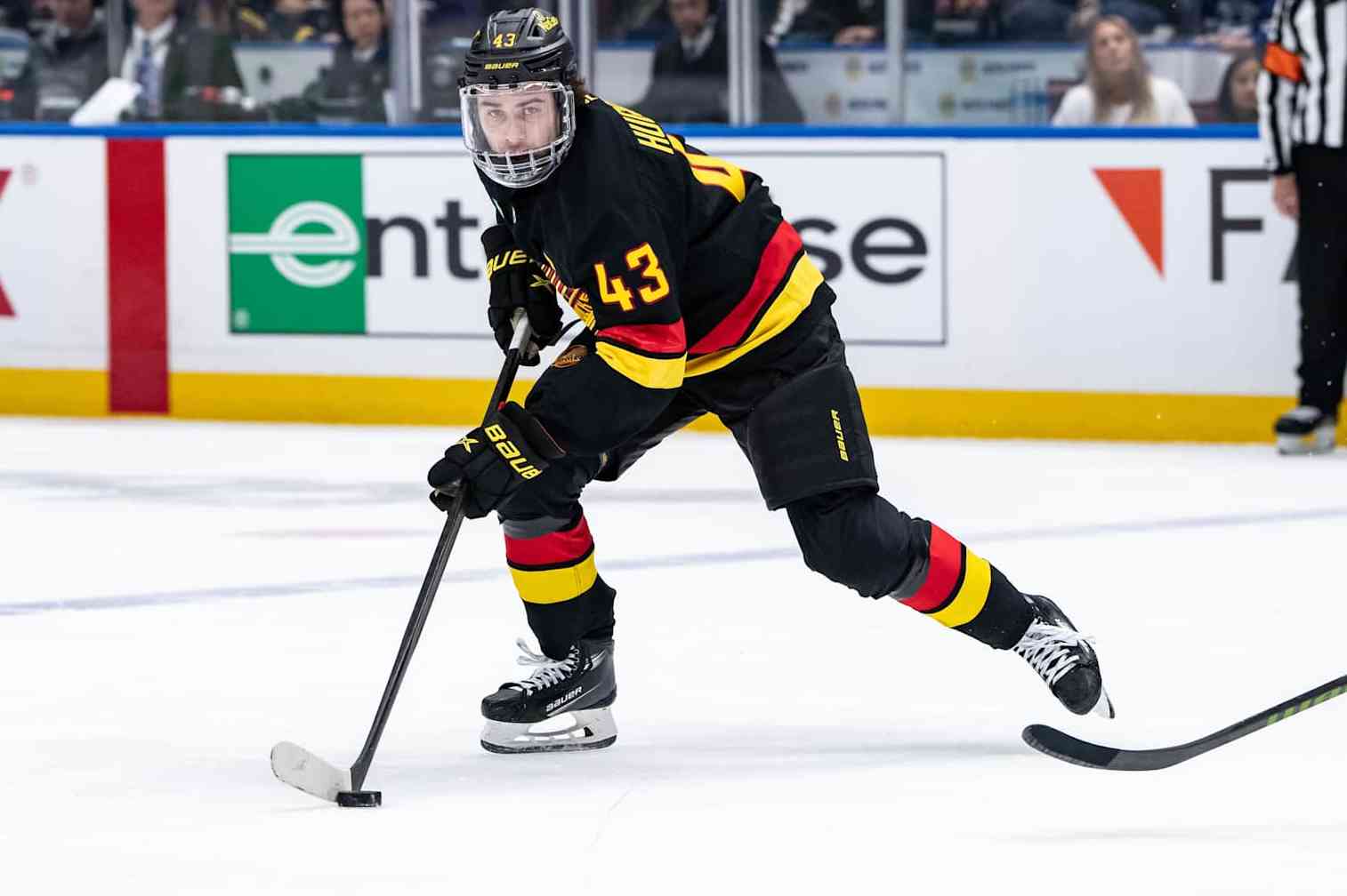 VANCOUVER, BC - DECEMBER 08: Vancouver Canucks defenseman Quinn Hughes (43) skates with the puck during the first period of an NHL game between the Tampa Bay Lightning and the Vancouver Canucks on Sunday, December 8, 2024 at Rogers Arena in Vancouver, B.C. (Photo by Ethan Cairns/Icon Sportswire via Getty Images)