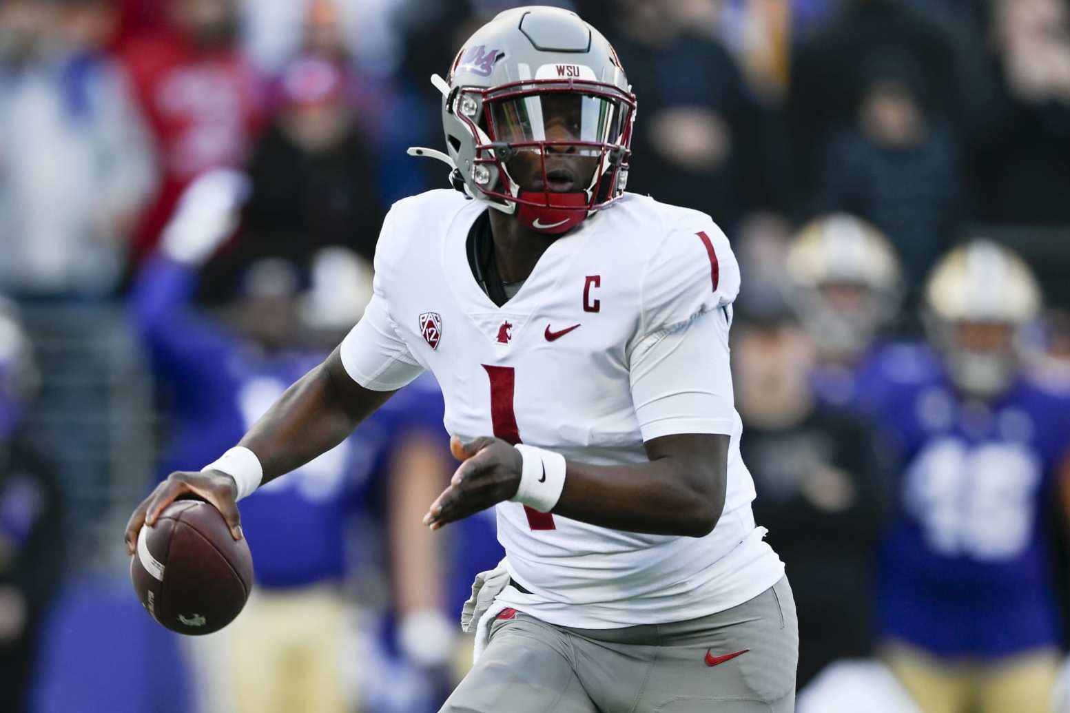 SEATTLE, WASHINGTON - NOVEMBER 25: Cameron Ward #1 of the Washington State Cougars moves in the pocket during the first quarter against the Washington Huskies at Husky Stadium on November 25, 2023 in Seattle, Washington. (Photo by Alika Jenner/Getty Images)