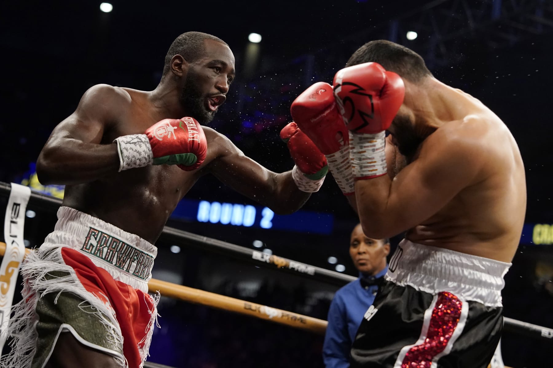 OMAHA, NEBRASKA - DECEMBER 10: WBO champion Terence Crawford (L) punches David Avanesyan during their welterweight title fight at CHI Health Center on December 10, 2022 in Omaha, Nebraska. (Photo by Ed Zurga/Getty Images)