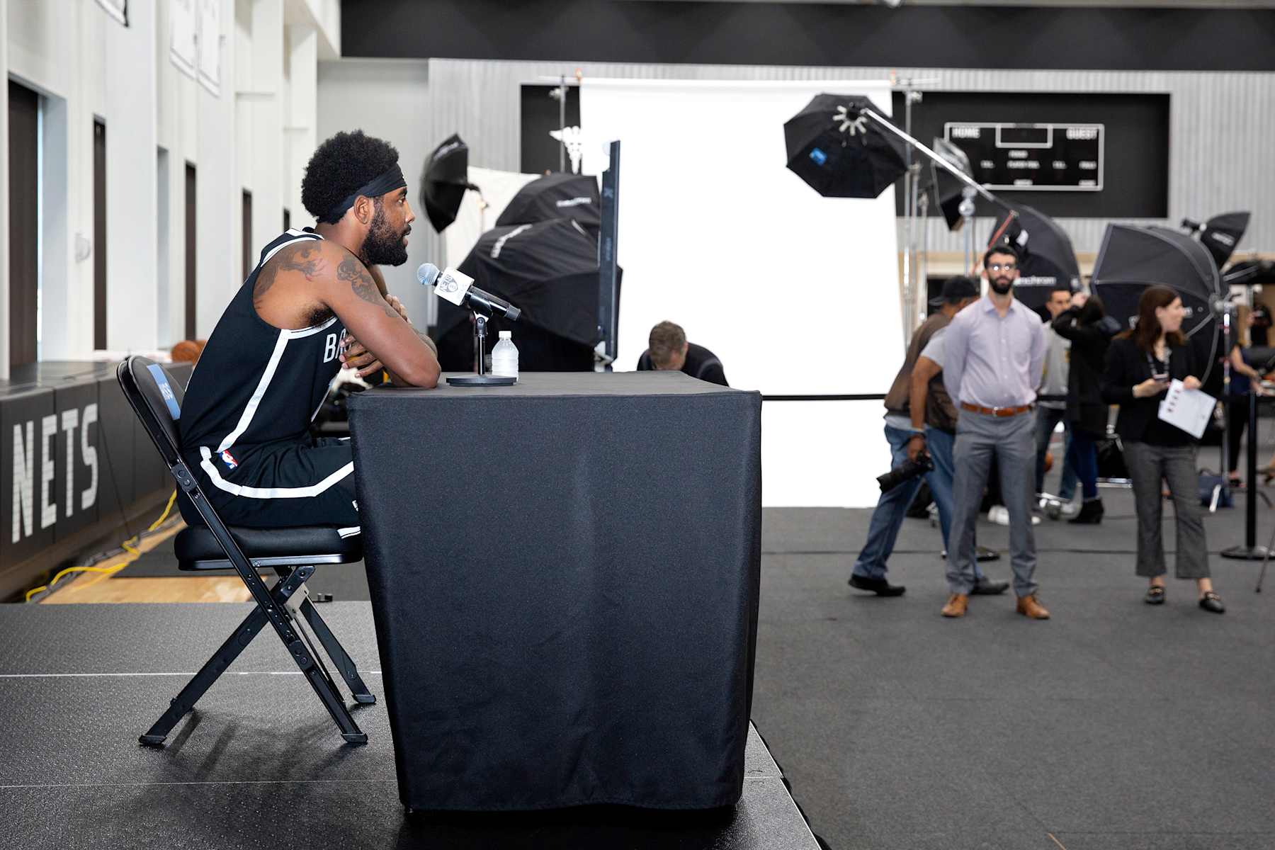 BROOKLYN, NY - SEPTEMBER 27: Kyrie Irving #11 of the Brooklyn Nets talks to the media during a press conference at Media Day on September 27, 2019 at HSS Training Center in Brooklyn, New York. NOTE TO USER: User expressly acknowledges and agrees that, by downloading and/or using this photograph, user is consenting to the terms and conditions of the Getty Images License Agreement. Mandatory Copyright Notice: Copyright 2019 NBAE (Photo by Jeyhoun Allebaugh/NBAE via Getty Images)