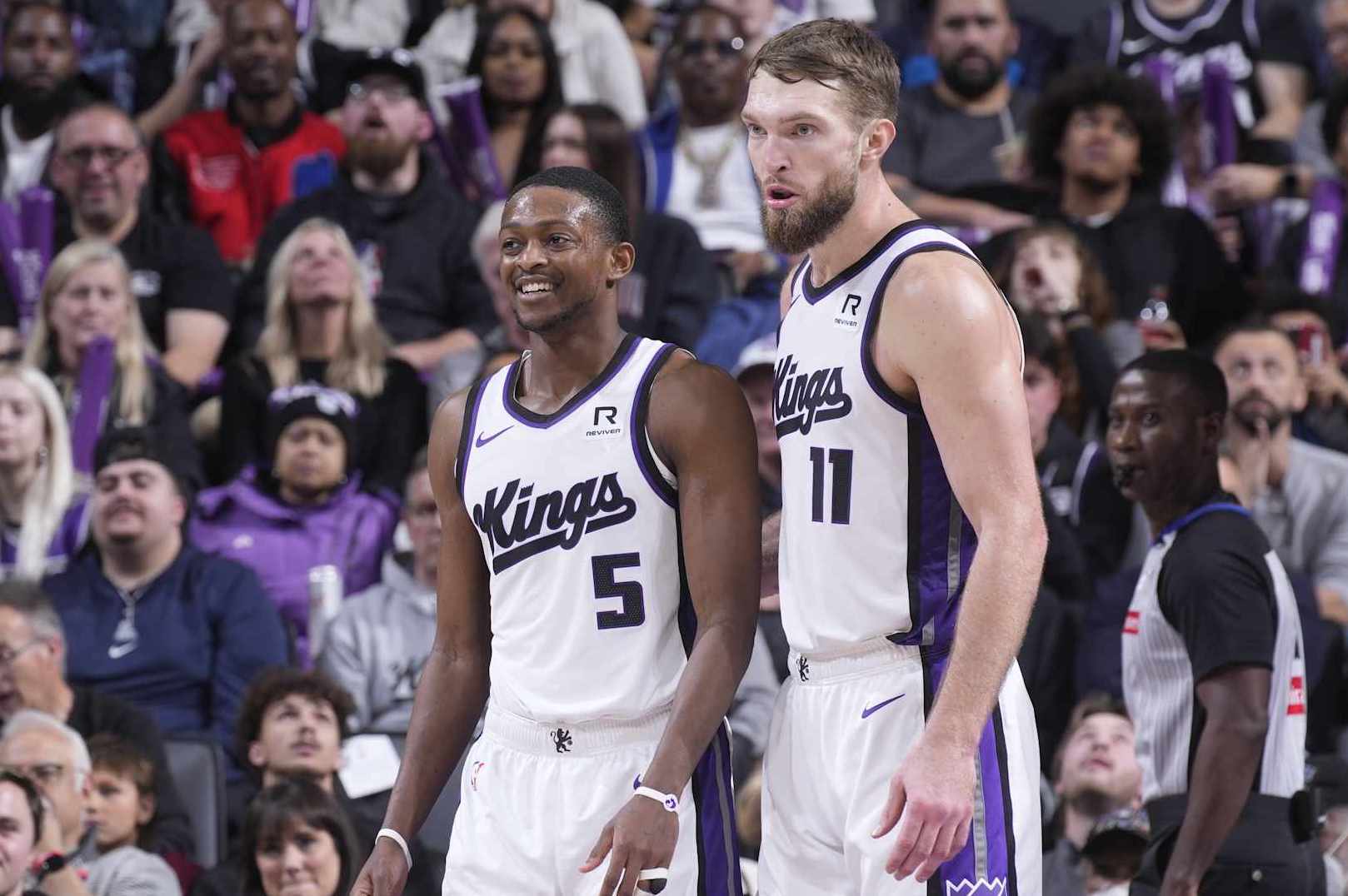 SACRAMENTO, CA - DECEMBER 30: De'Aaron Fox #5 and Domantas Sabonis #11 of the Sacramento Kings look on during the game against the Dallas Mavericks on December 30, 2024 at Golden 1 Center in Sacramento, California. NOTE TO USER: User expressly acknowledges and agrees that, by downloading and or using this photograph, User is consenting to the terms and conditions of the Getty Images Agreement. Mandatory Copyright Notice: Copyright 2024 NBAE (Photo by Rocky Widner/NBAE via Getty Images)