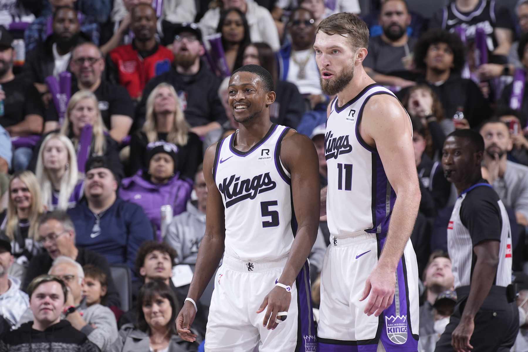 SACRAMENTO, CA - DECEMBER 30: De'Aaron Fox #5 and Domantas Sabonis #11 of the Sacramento Kings look on during the game against the Dallas Mavericks on December 30, 2024 at Golden 1 Center in Sacramento, California. NOTE TO USER: User expressly acknowledges and agrees that, by downloading and or using this photograph, User is consenting to the terms and conditions of the Getty Images Agreement. Mandatory Copyright Notice: Copyright 2024 NBAE (Photo by Rocky Widner/NBAE via Getty Images)