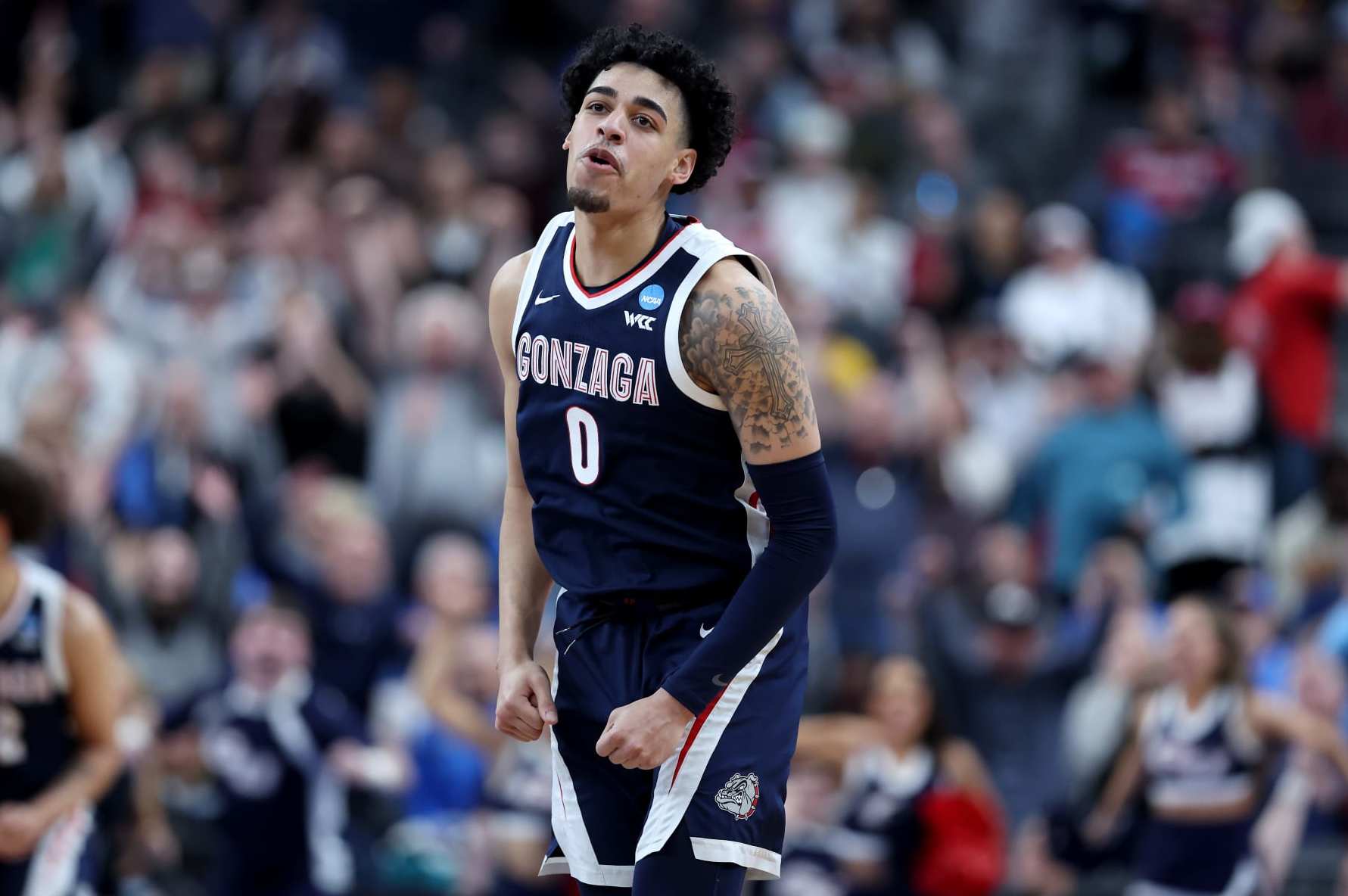LAS VEGAS, NEVADA - MARCH 23: Julian Strawther #0 of the Gonzaga Bulldogs reacts after scoring a three-point basket against the UCLA Bruins during the second half in the Sweet 16 round of the NCAA Men's Basketball Tournament at T-Mobile Arena on March 23, 2023 in Las Vegas, Nevada. (Photo by Sean M. Haffey/Getty Images)