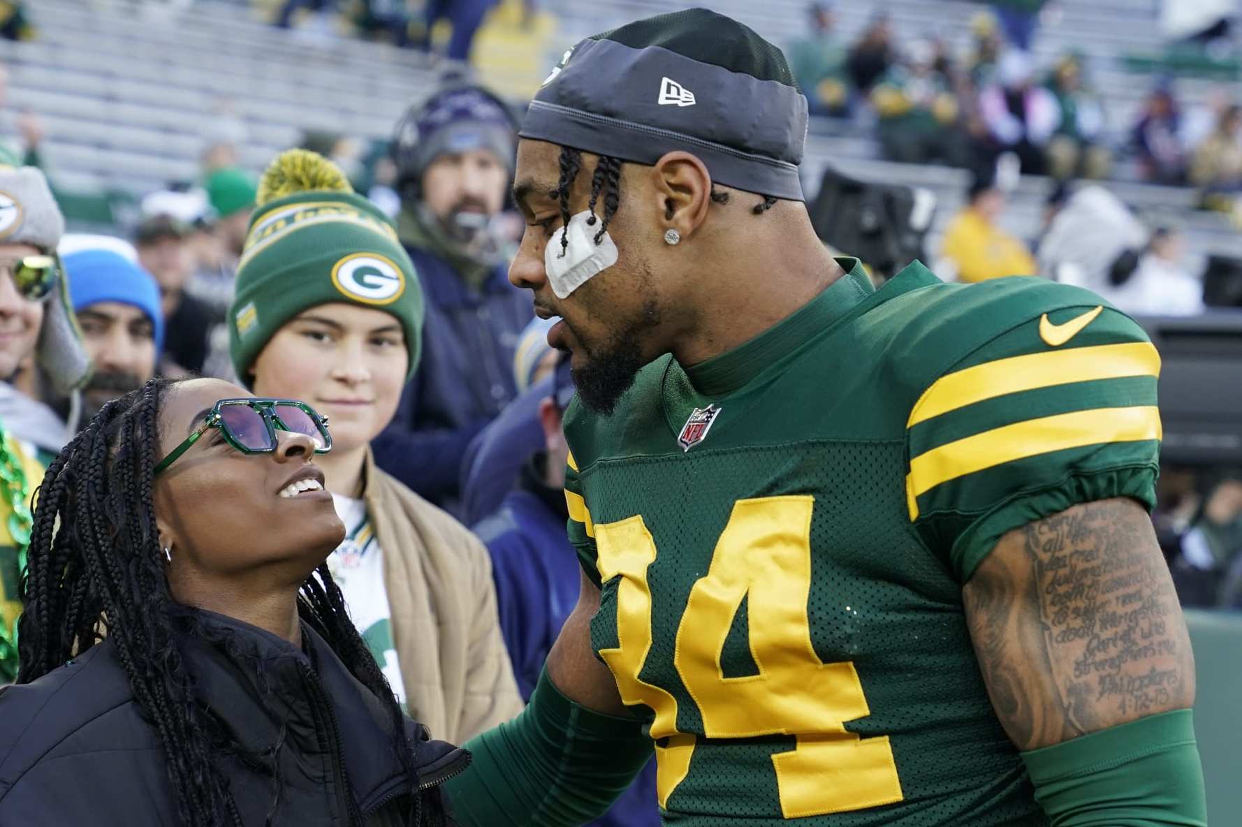 GREEN BAY, WISCONSIN - NOVEMBER 19: Jonathan Owens #34 of the Green Bay Packers meets with wife Simone Biles before the game against the Los Angeles Chargers at Lambeau Field on November 19, 2023 in Green Bay, Wisconsin. (Photo by Patrick McDermott/Getty Images)