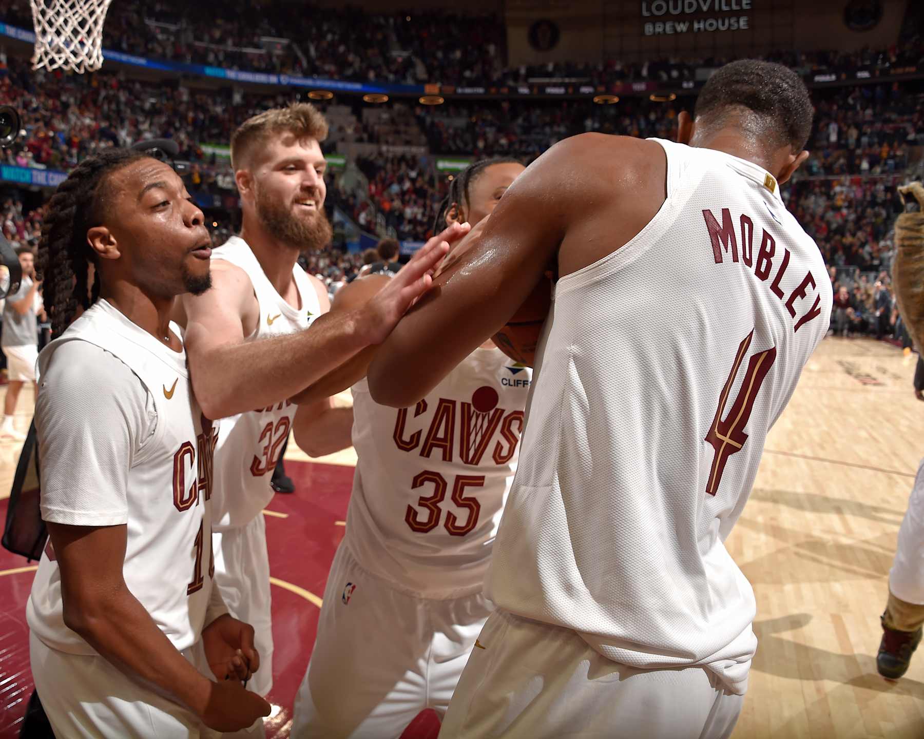 CLEVELAND, OH - NOVEMBER 9: Evan Mobley #4 of the Cleveland Cavaliers celebrates with teammates after the game against the Brooklyn Nets on November 9, 2024 at Rocket Mortgage FieldHouse in Cleveland, Ohio. NOTE TO USER: User expressly acknowledges and agrees that, by downloading and/or using this Photograph, user is consenting to the terms and conditions of the Getty Images License Agreement. Mandatory Copyright Notice: Copyright 2024 NBAE (Photo by David Liam Kyle/NBAE via Getty Images)