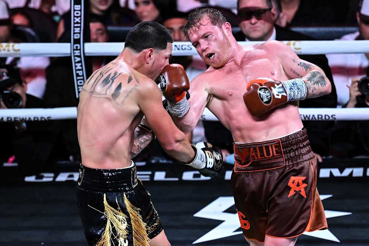 LAS VEGAS, NEVADA - SEPTEMBER 14: Saul 'Canelo' Alvarez (in brown short) from Guadalajara, Mexico and Edgar Berlanga (in black&gold short) from Brooklyn, New York exchange punches during their super middleweight world titles of the Premiere Boxing Championship on Saturday night at the T-Mobile Arena in Las Vegas, Nevada, United States on September 14, 2024. (Photo by Tayfun Coskun/Anadolu via Getty Images)