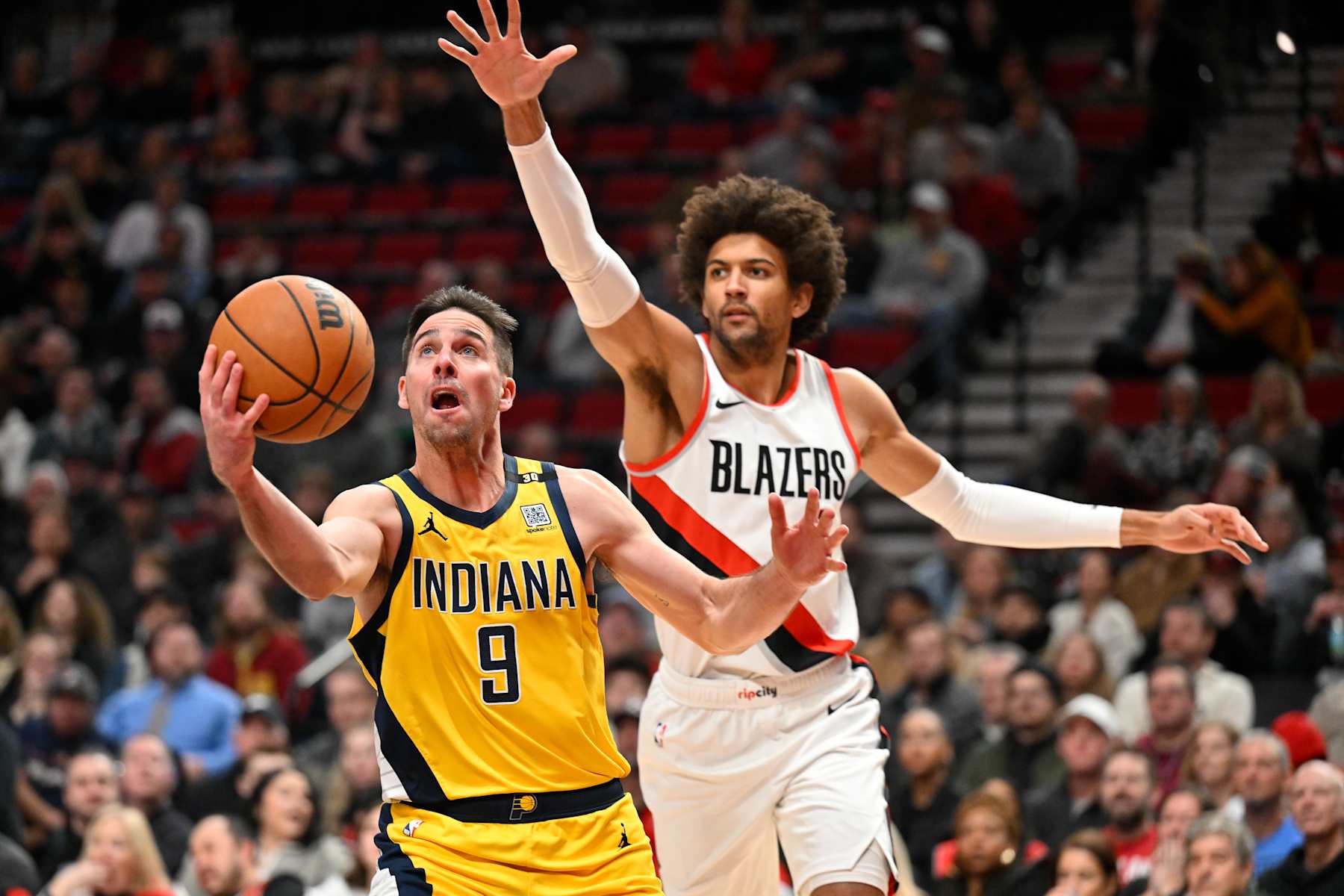 PORTLAND, OREGON - JANUARY 19: T.J. McConnell #9 of the Indiana Pacers shoots against Matisse Thybulle #4 of the Portland Trail Blazers during the second quarter of the game at Moda Center on January 19, 2024 in Portland, Oregon. NOTE TO USER: User expressly acknowledges and agrees that, by downloading and or using this photograph, User is consenting to the terms and conditions of the Getty Images License Agreement. (Photo by Alika Jenner/Getty Images)